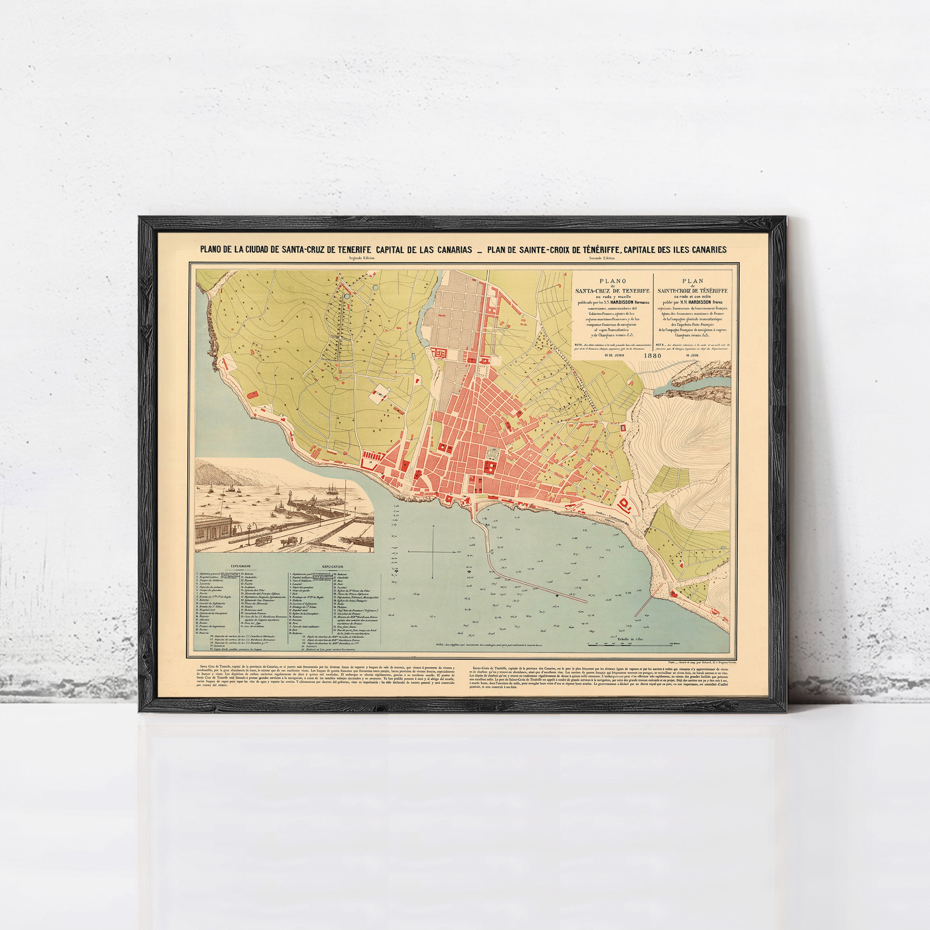 The image is a framed map of a coastal city, depicting the city's layout, surrounding areas, and possibly a harbor.