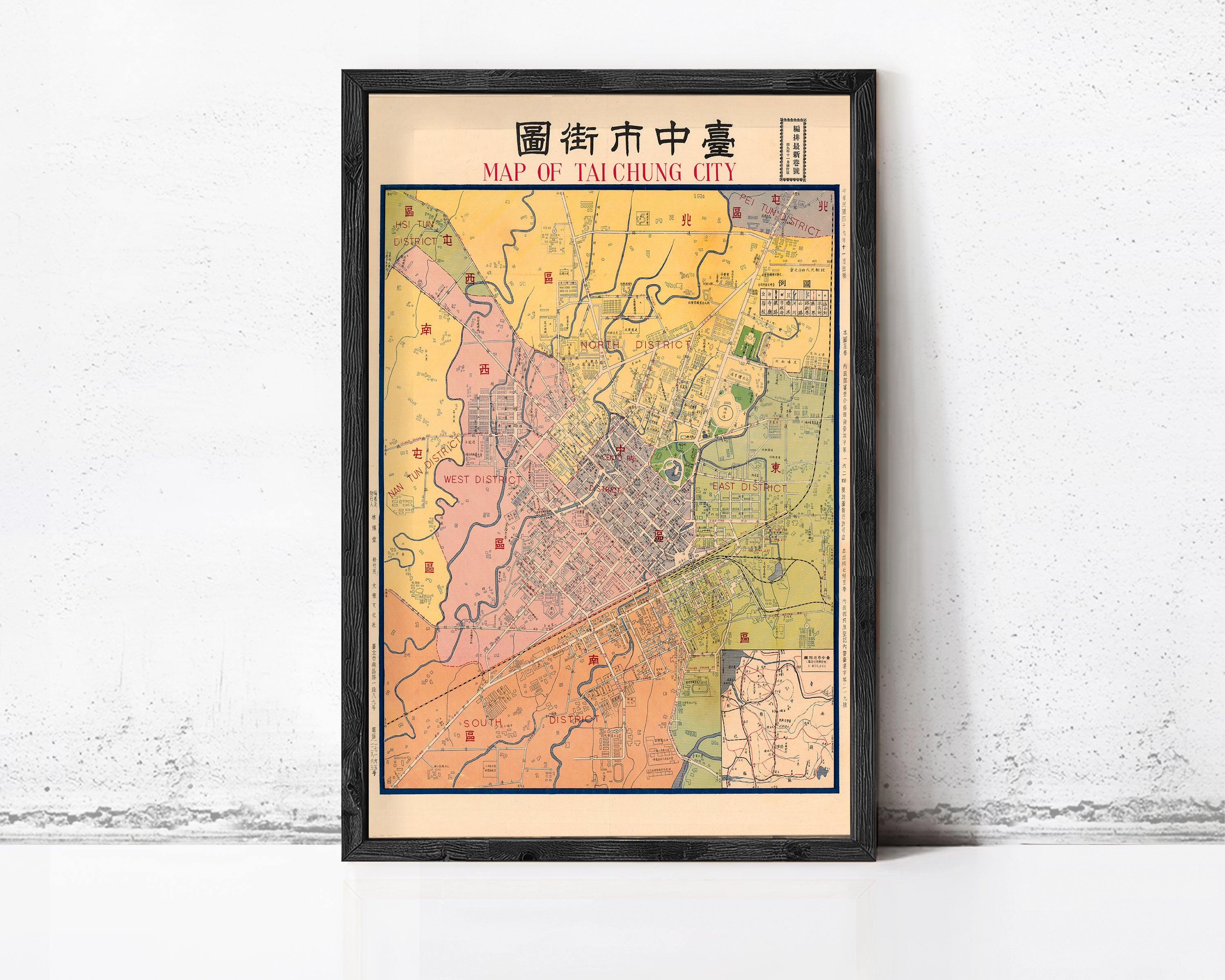 The image is a framed map of Taipei City, Taiwan, with various colored sections representing different neighborhoods and districts within the city.