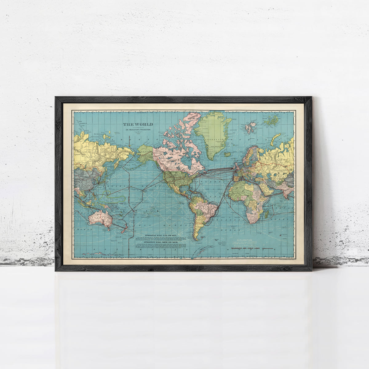 The image is a framed vintage map of the world, depicting the continents and oceans in a colorful and detailed manner.