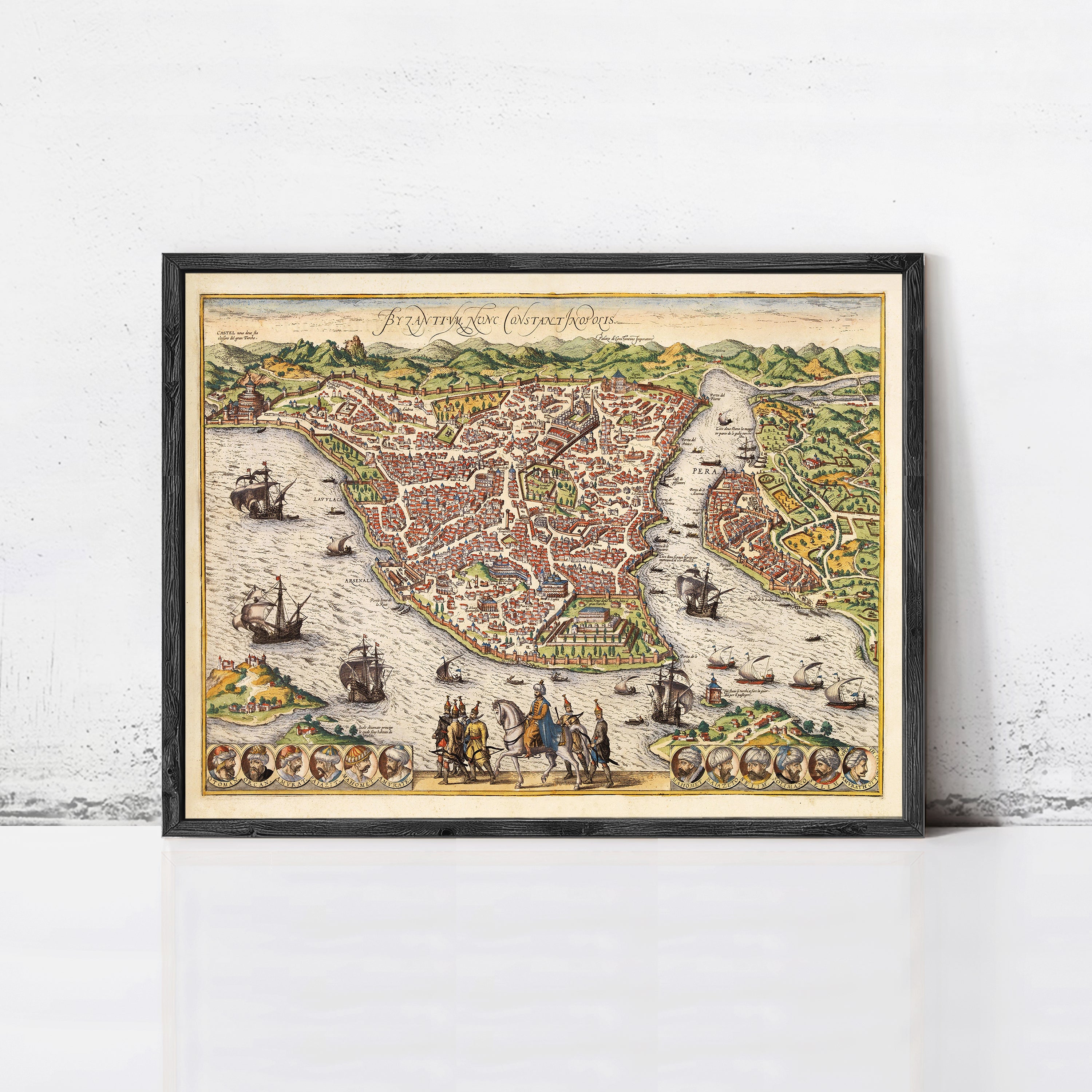 The image is a framed vintage map of a city, depicting a detailed and colorful representation of the city's layout, including waterways, buildings, and ships.