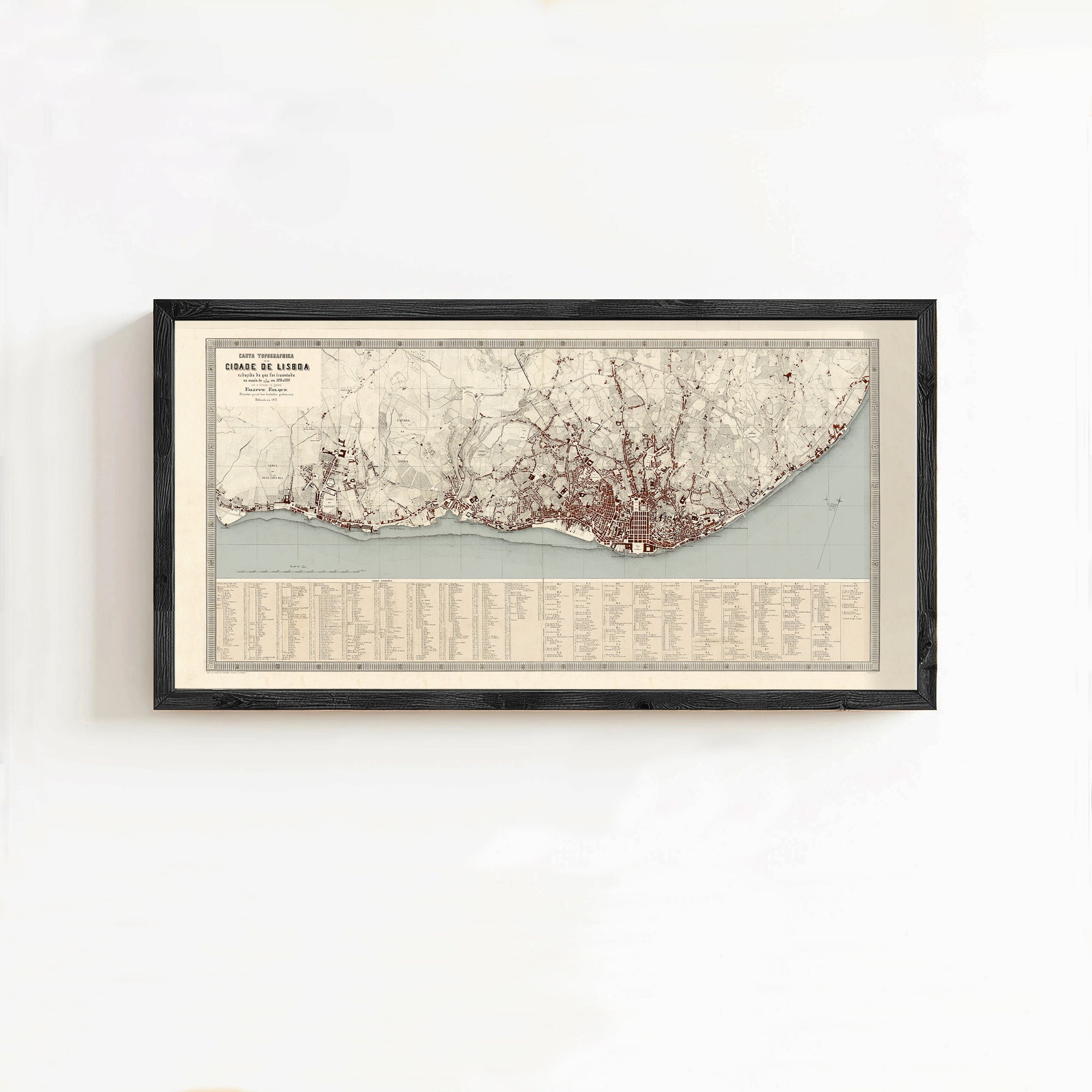The image is a framed map of a city, likely London, with a detailed layout of the city's streets, landmarks, and surrounding areas.