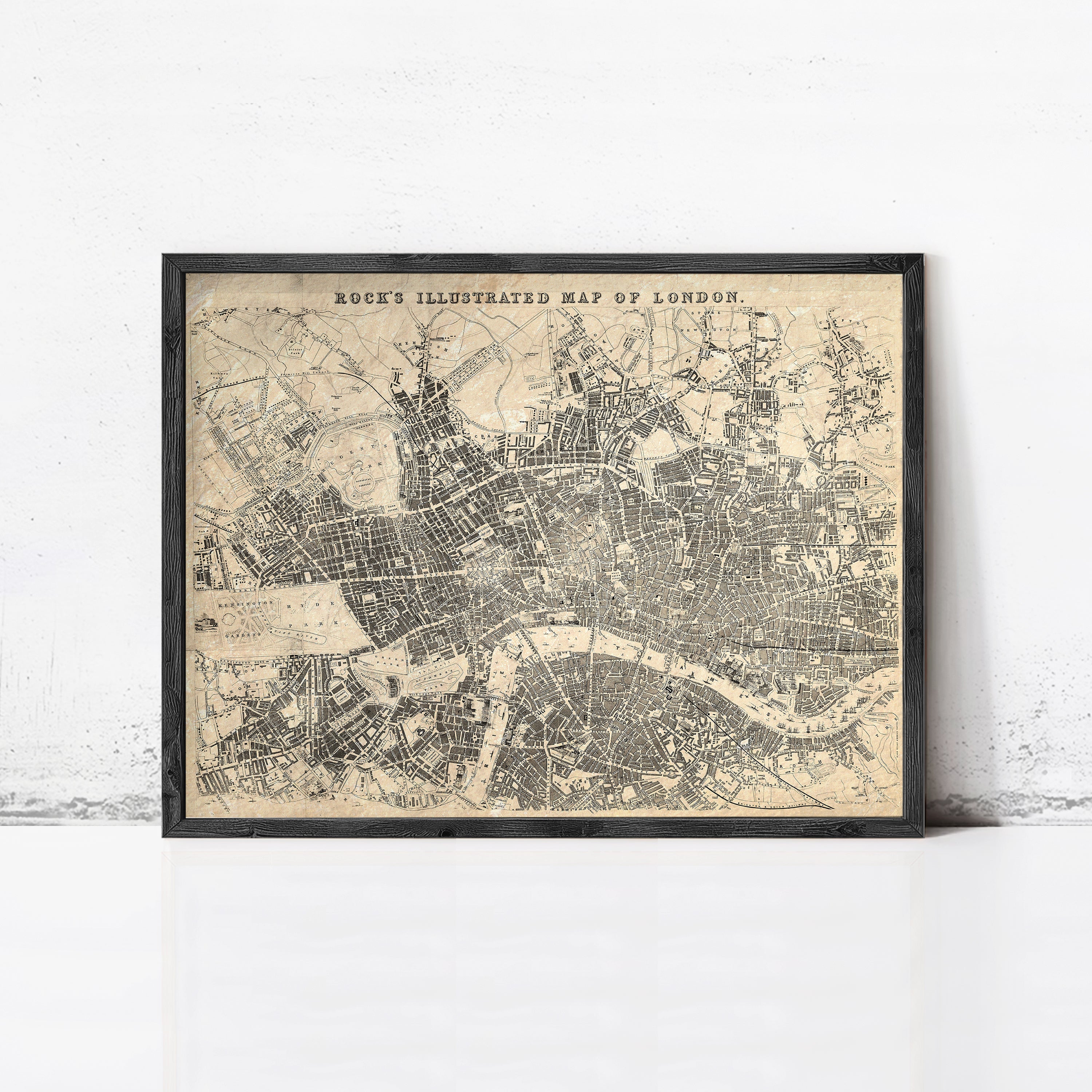The image is a framed illustration of a map of London, depicting the city's streets and landmarks.