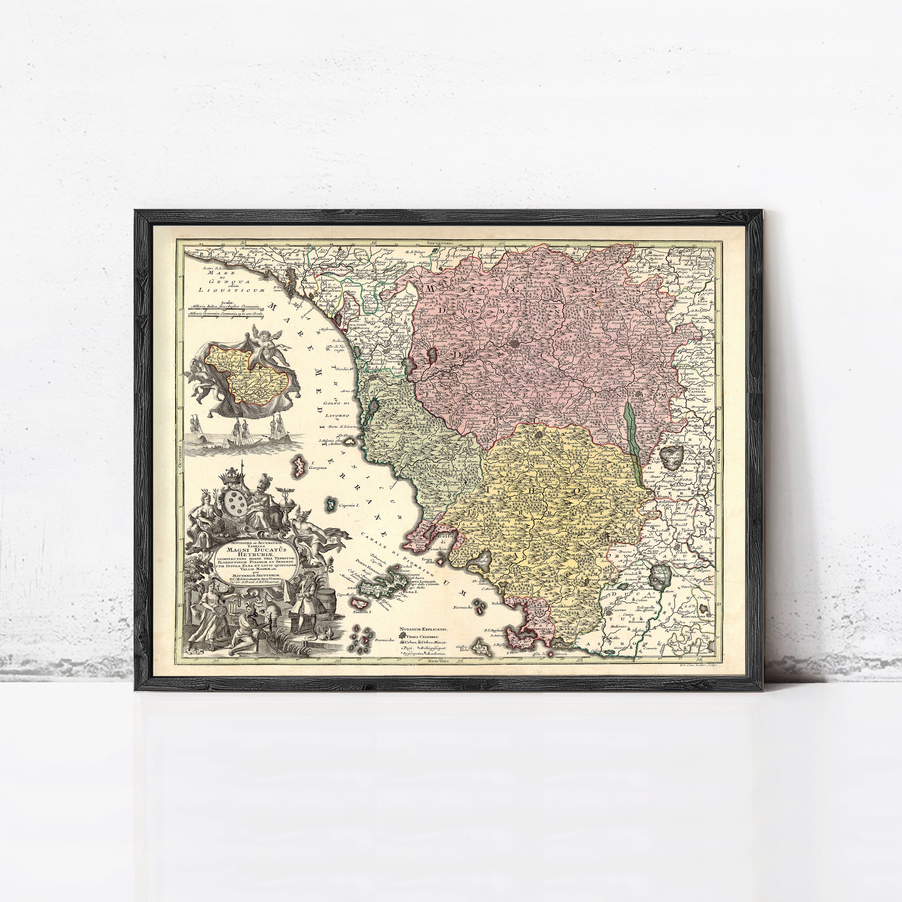 The image is a framed antique map of Europe, featuring detailed illustrations and color-coded regions.