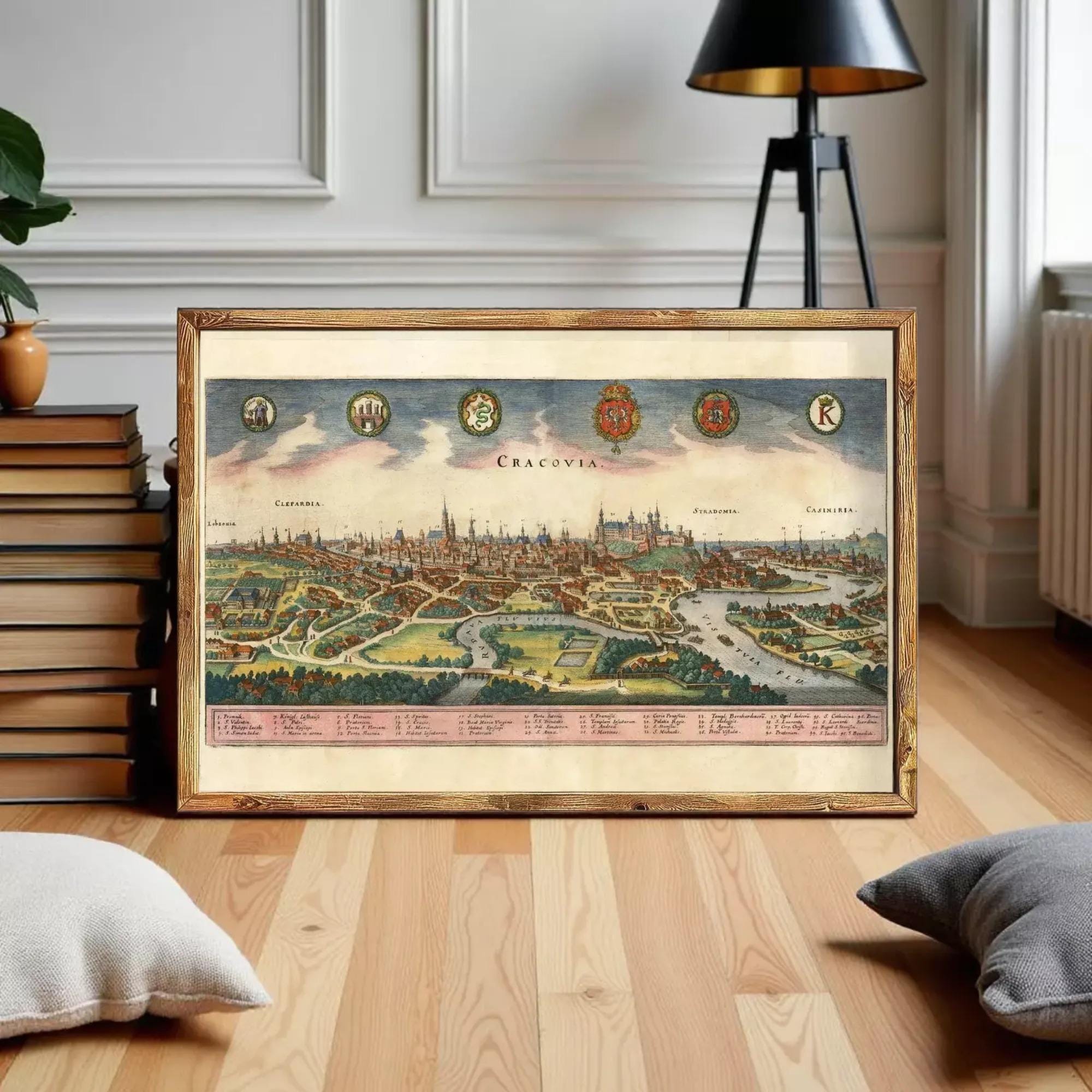 The image is a framed vintage map of Prague, Czech Republic, depicting the city's skyline and surrounding landscape.