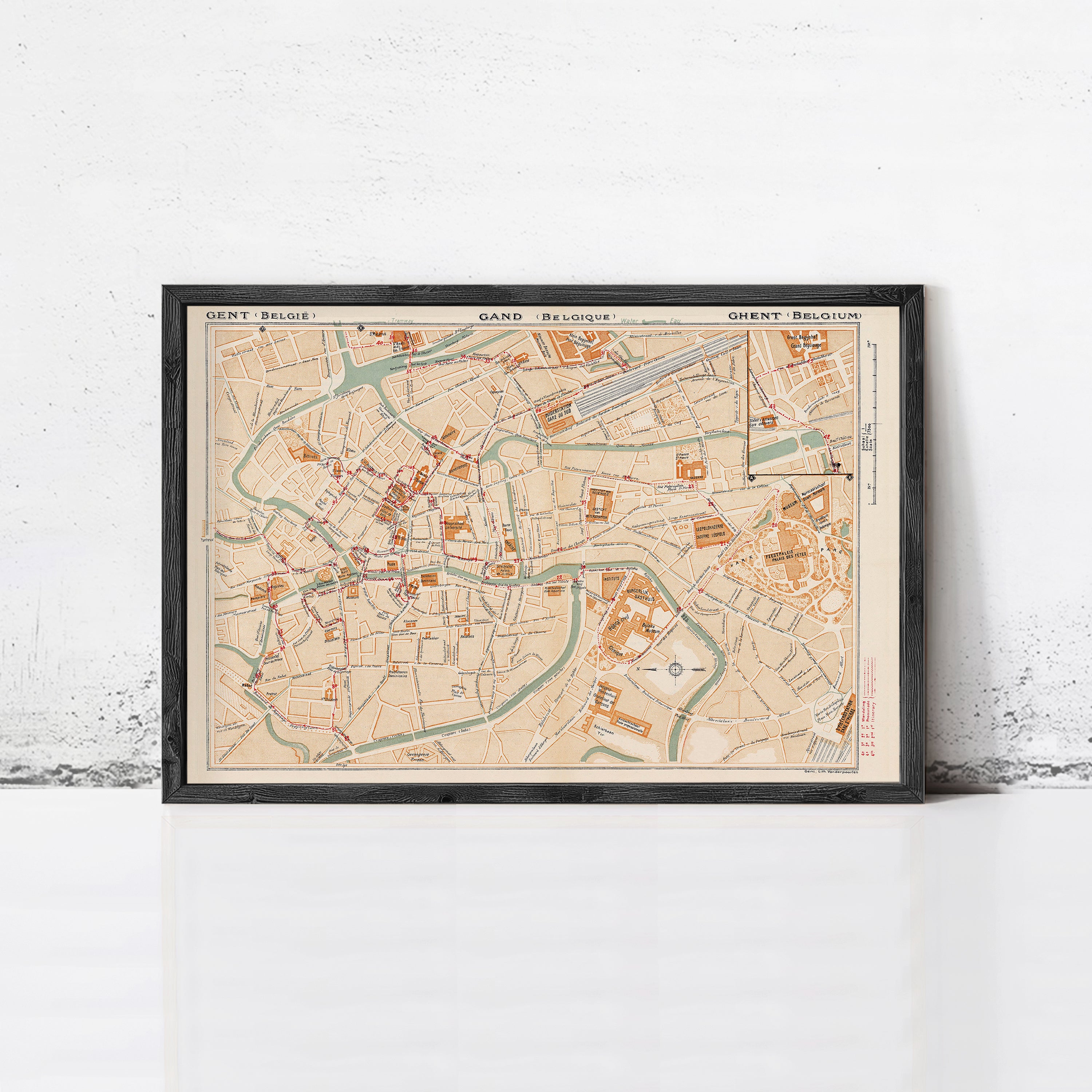 The image is a framed map of Brussels, Belgium, showing the city's streets, landmarks, and surrounding areas.
