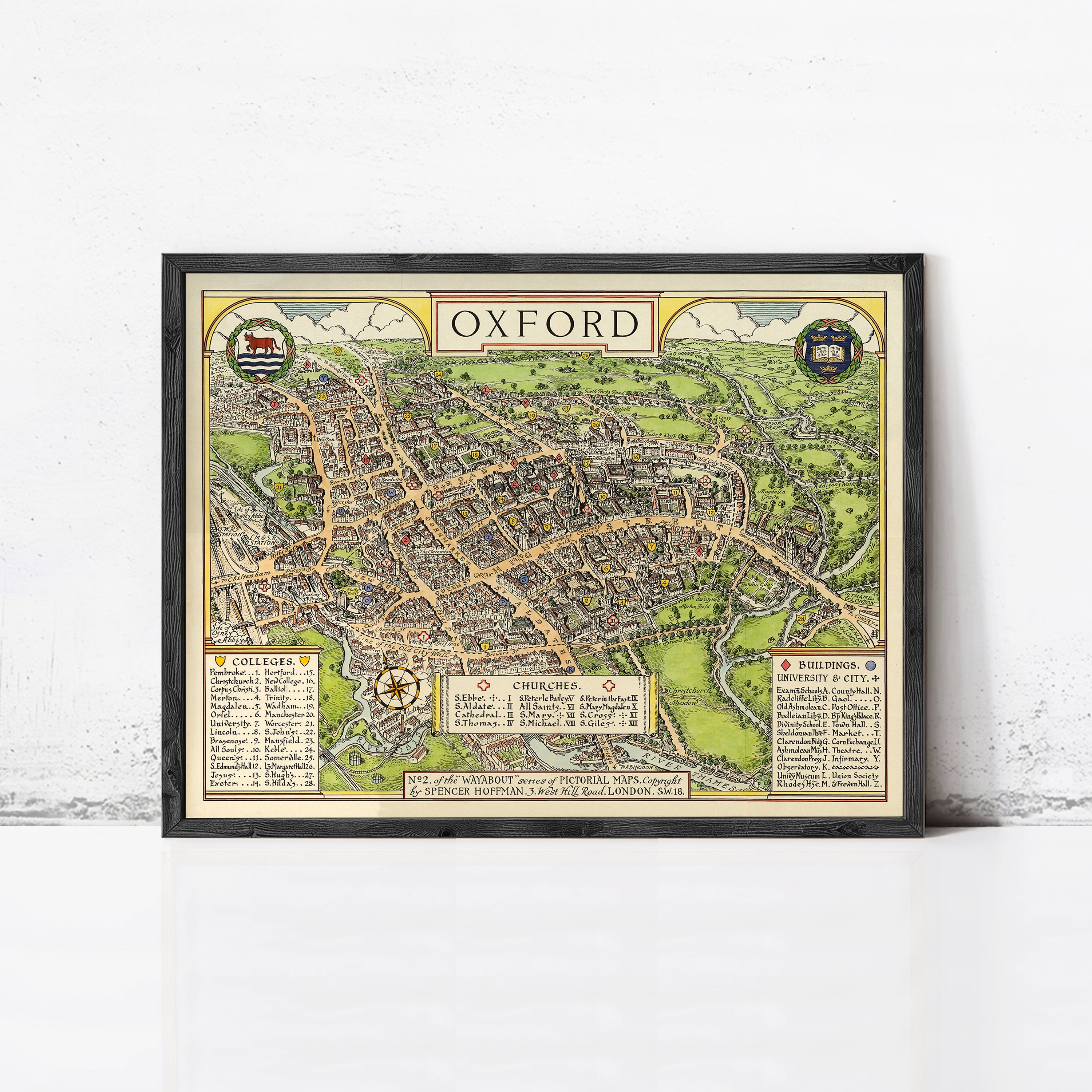 The image is a framed vintage map of Oxford, England, depicting the city's layout and surrounding areas.