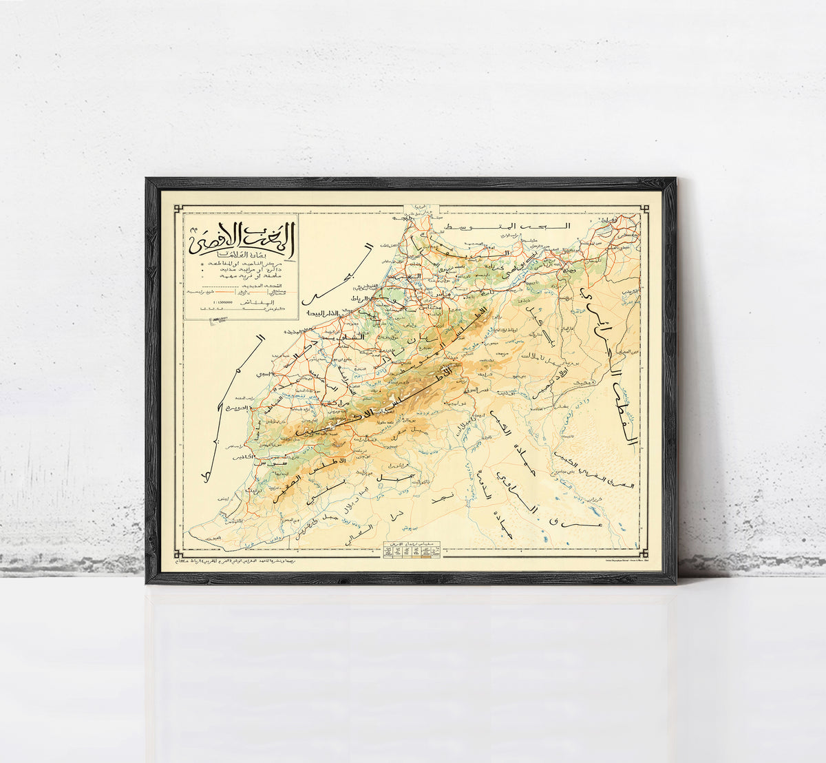 The image is a framed vintage map of a region, likely depicting a mountainous area, with various roads and landmarks marked on it.