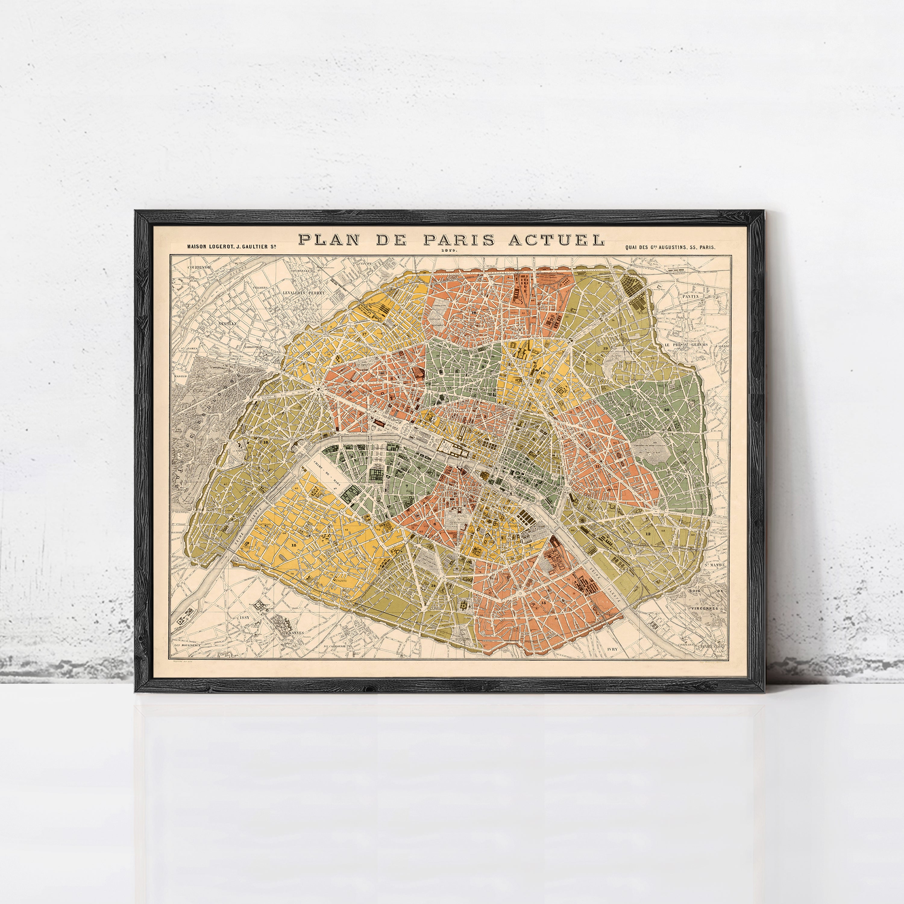 The image is a framed vintage map of Paris, France, depicting the city's streets and landmarks.