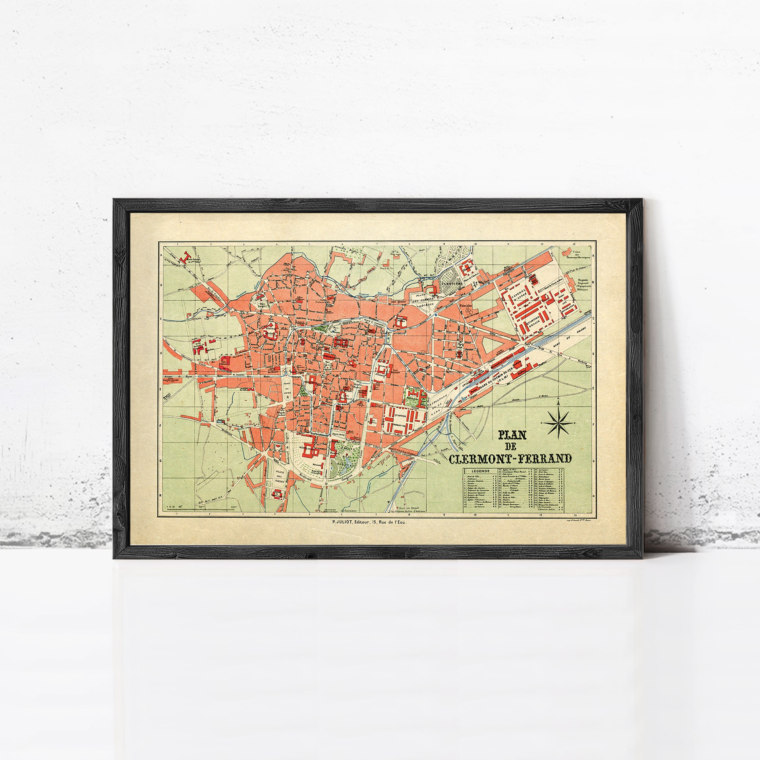 The image is a framed vintage map of Clermont-Ferrand, France, depicting the city's layout and surrounding areas.