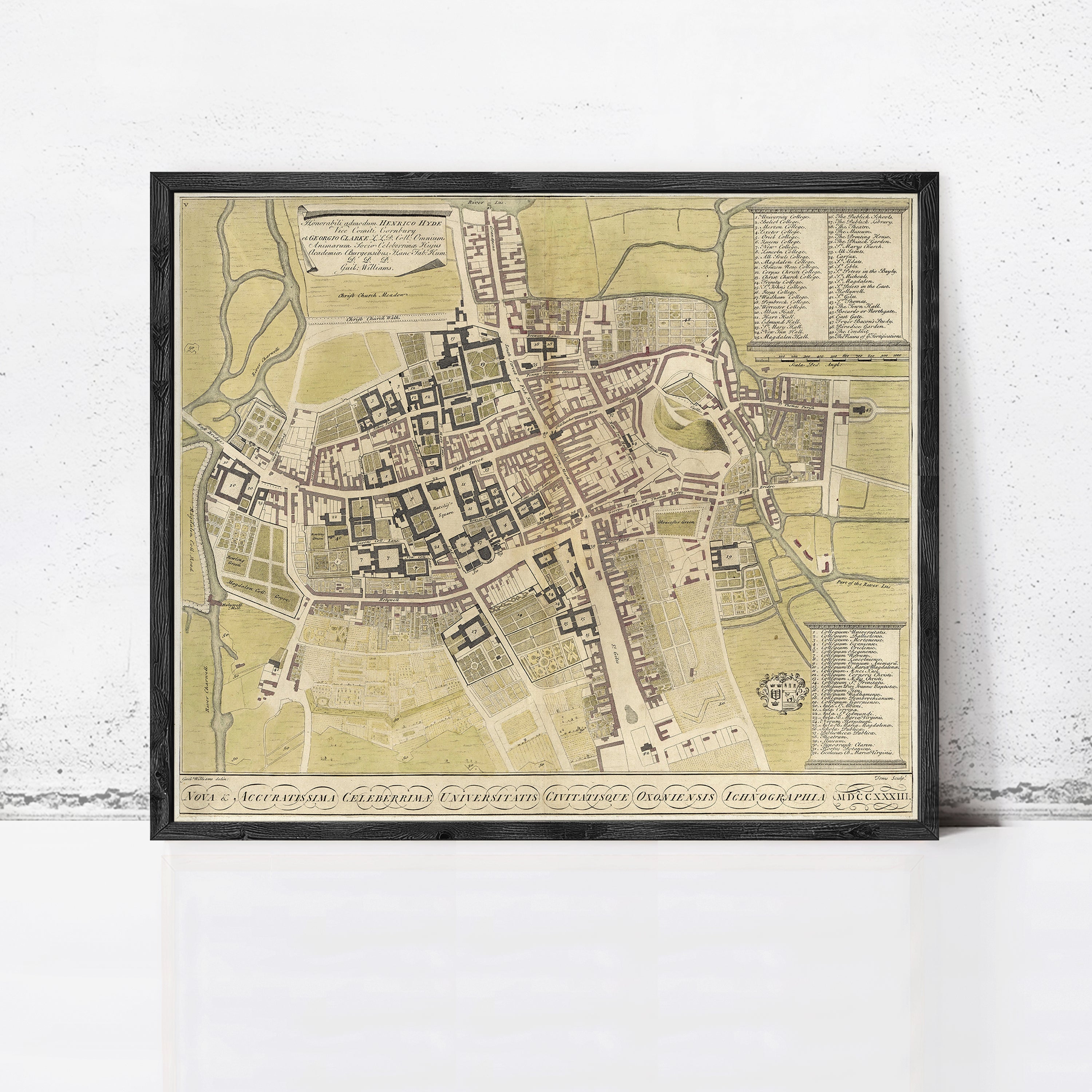The image is a framed map of a city, likely from the 17th century, depicting a detailed layout of the streets, buildings, and other urban features.