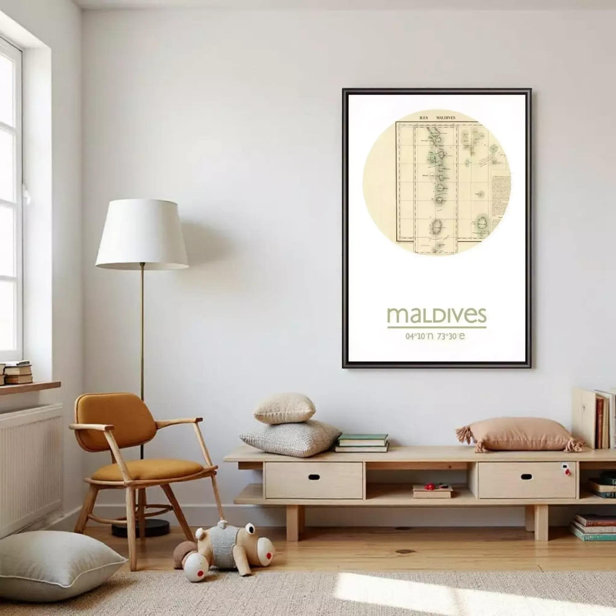a cozy living room with a wooden entertainment center, a lamp, a chair, and a framed map of the Maldives hanging on the wall.