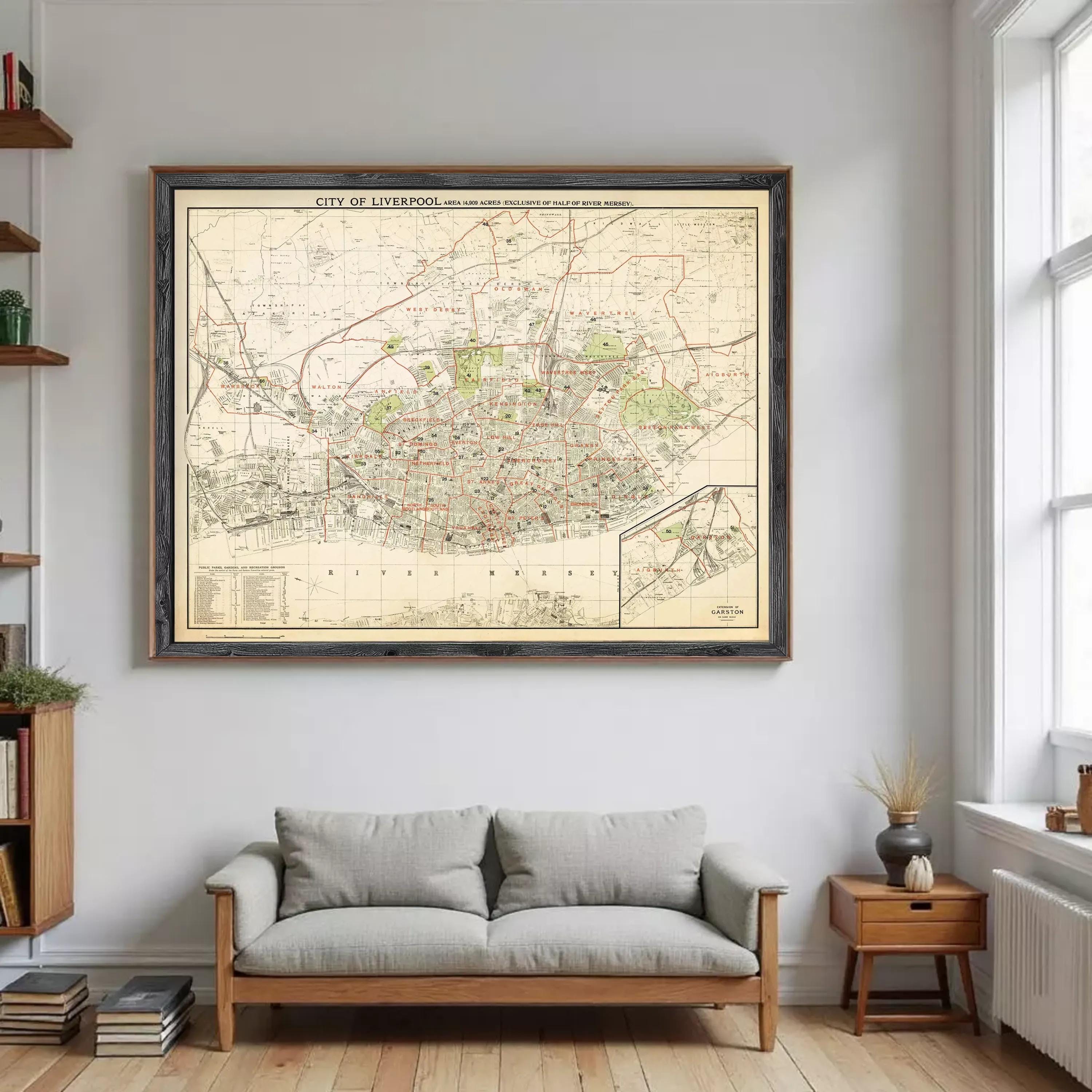 a large framed map of Liverpool hanging on a wall in a living room.
