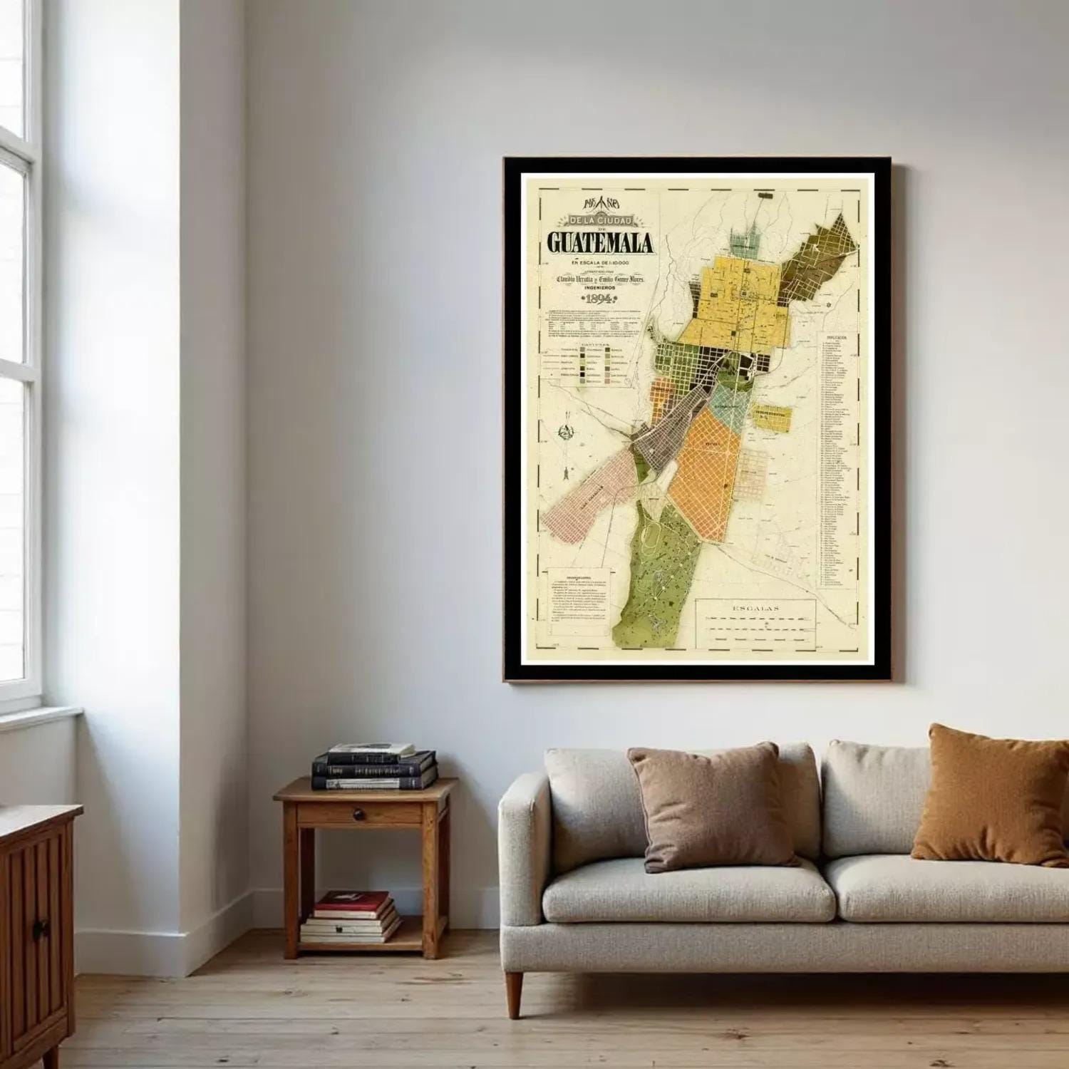 a large framed map of Guatemala hanging on a wall in a living room.