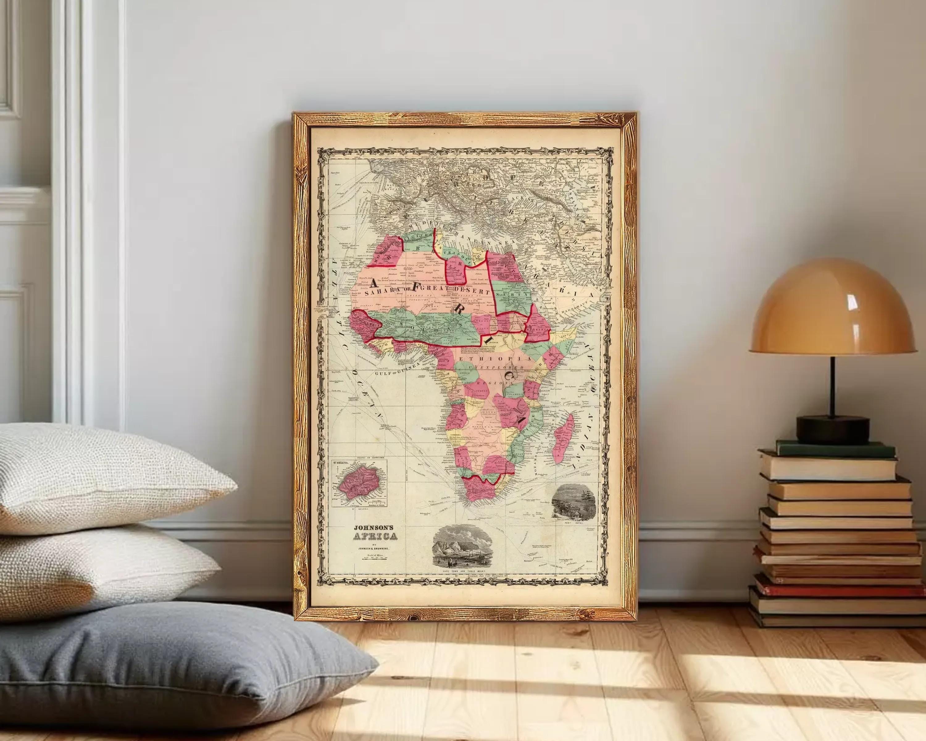 The image is a framed antique map of Africa, depicting the continent in a vintage style with a wooden frame.