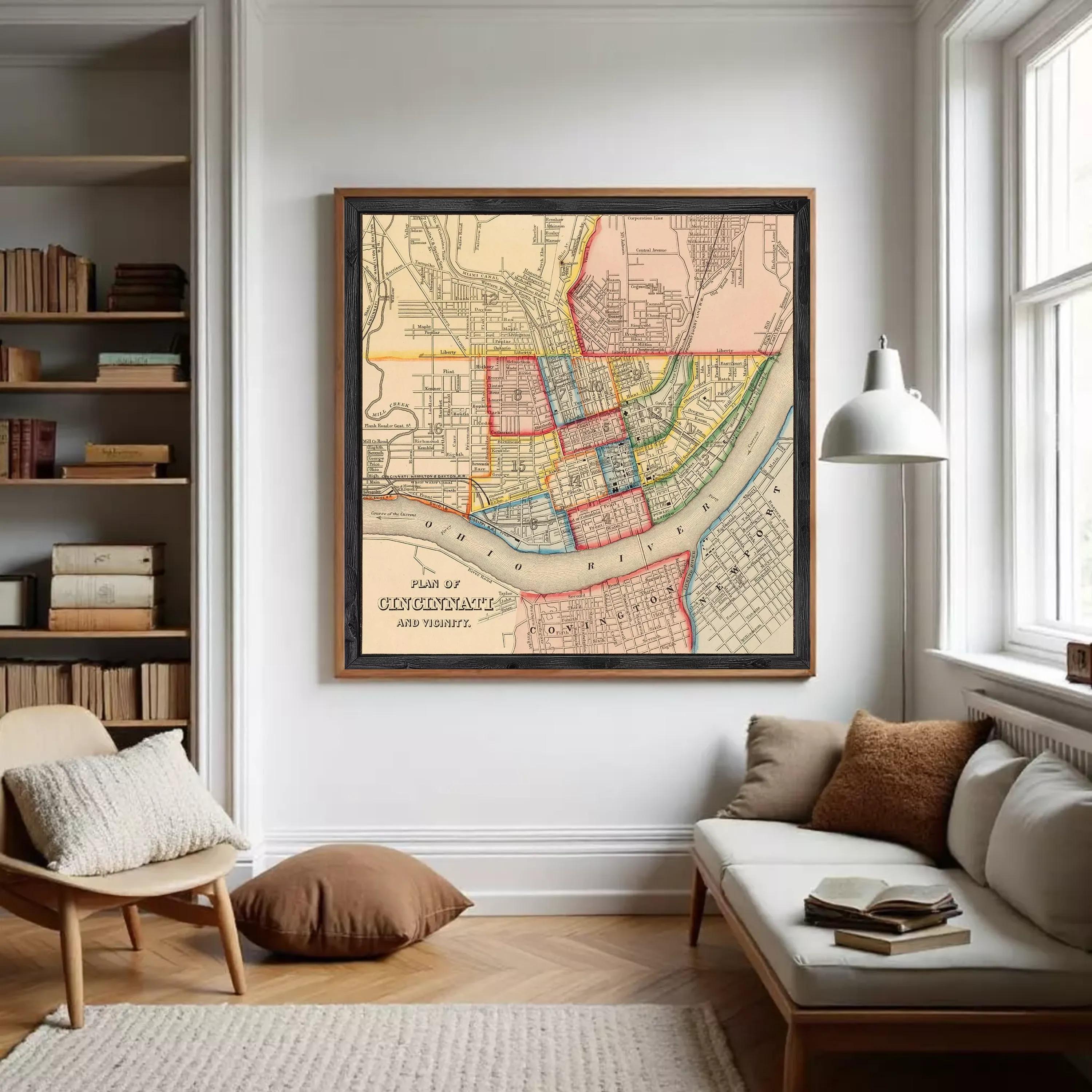 A framed vintage map of Cincinnati, Ohio, depicting the city's layout and surrounding areas.