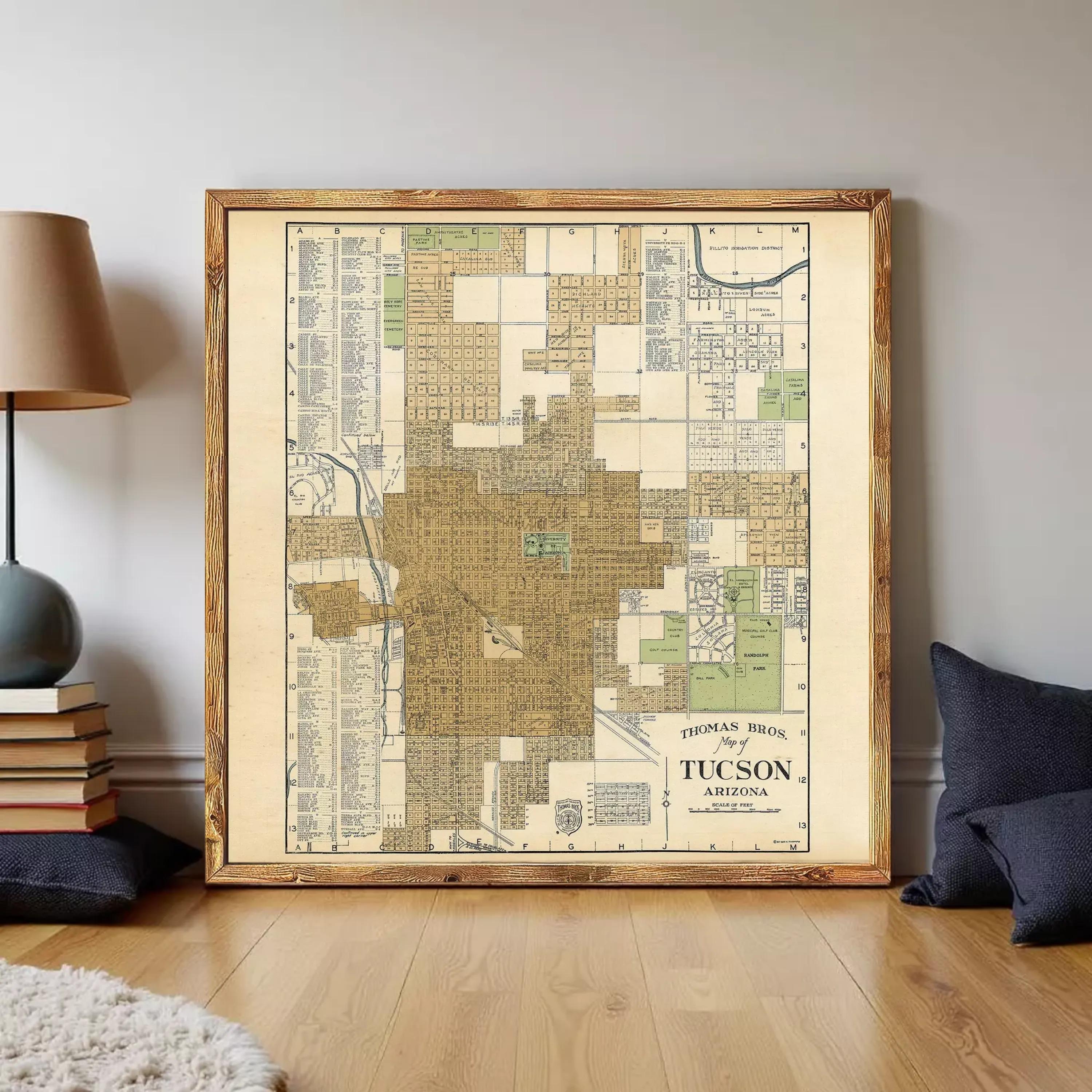 The image is a framed vintage map of Tucson, Arizona, depicting the city's layout and surrounding areas.