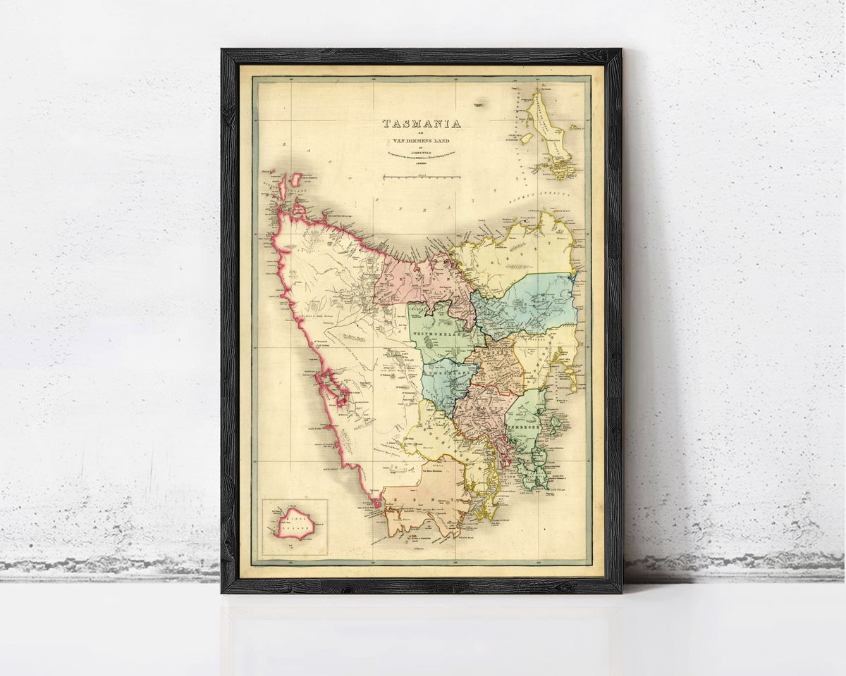 The image is a framed vintage map of Tasmania, Australia, depicting the state's geographical layout and boundaries.
