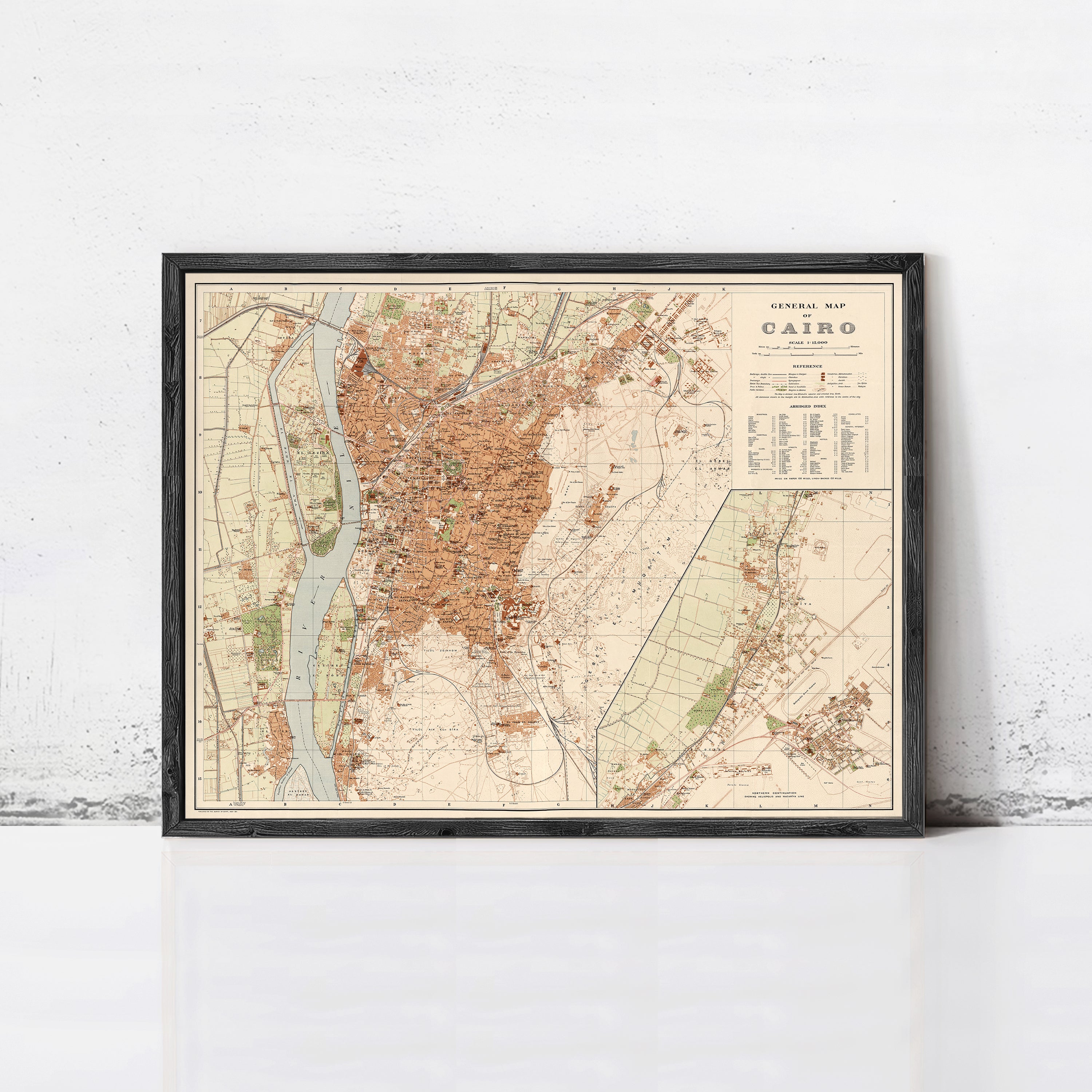 The image is a framed vintage map of Cairo, Egypt, depicting the city's layout and surrounding areas.