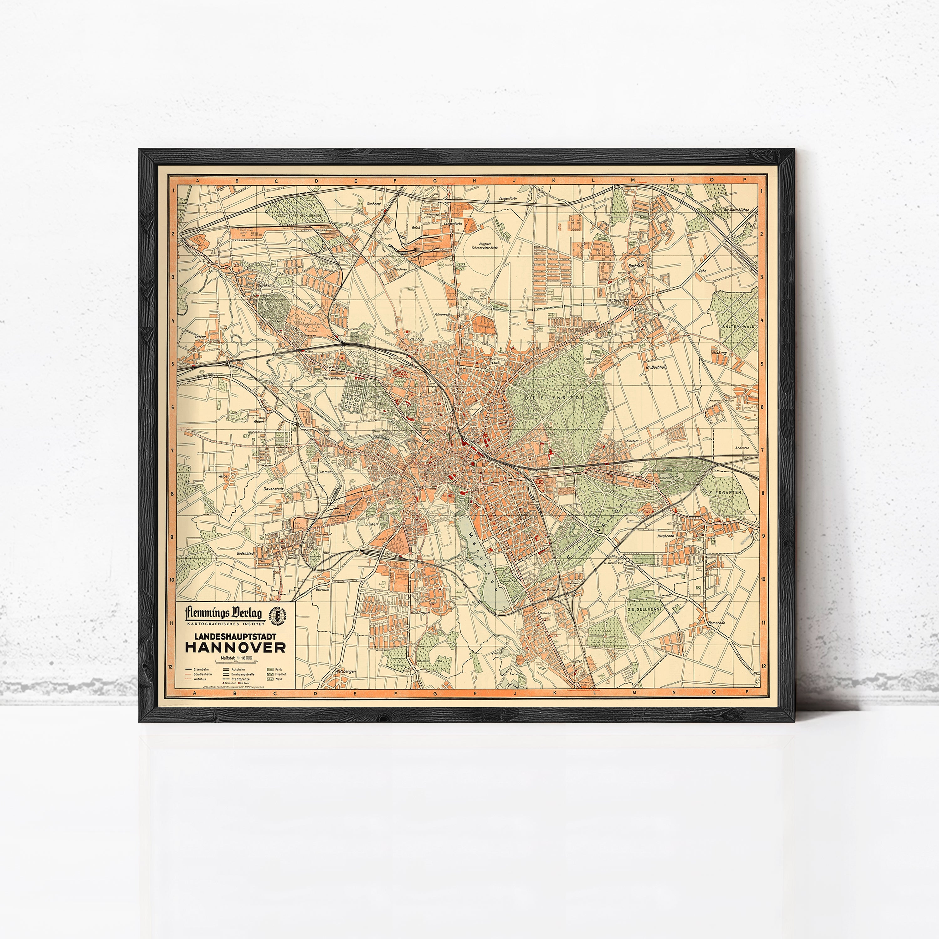 The image is a framed vintage map of the city of Hannover, Germany, depicting the city's streets, landmarks, and surrounding areas.