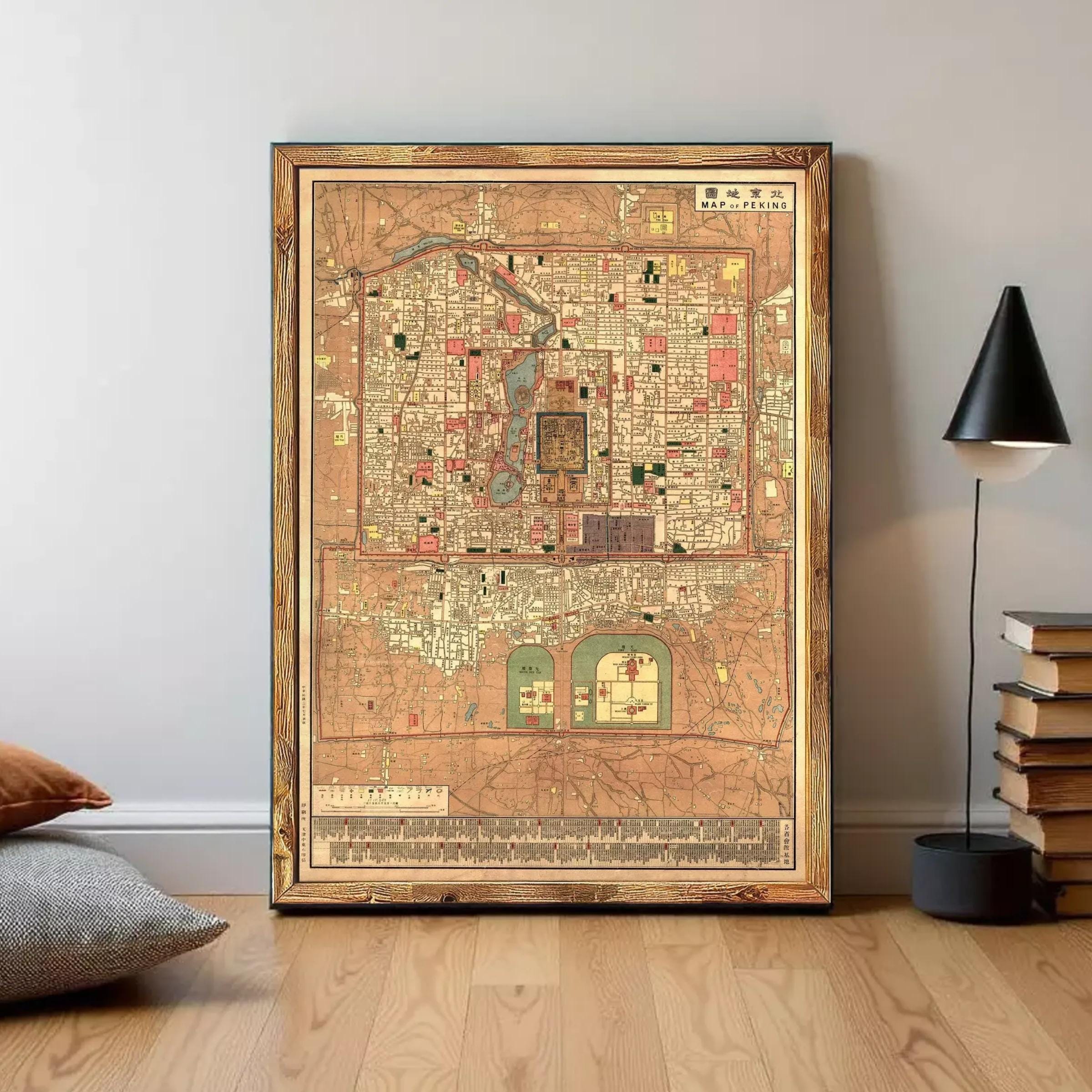 The image is a framed antique map of a city, likely from the 19th century, with intricate details and a vintage appearance.