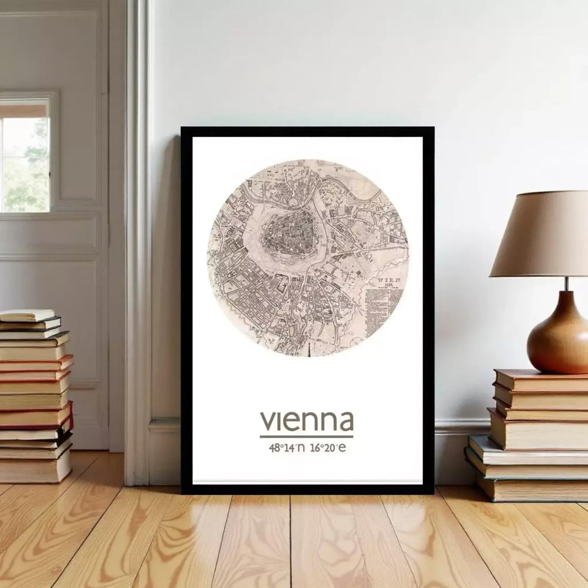 A framed map of Vienna, Austria, with the word "vienna" written below it, is displayed on a wall in a room with a stack of books and a lamp.