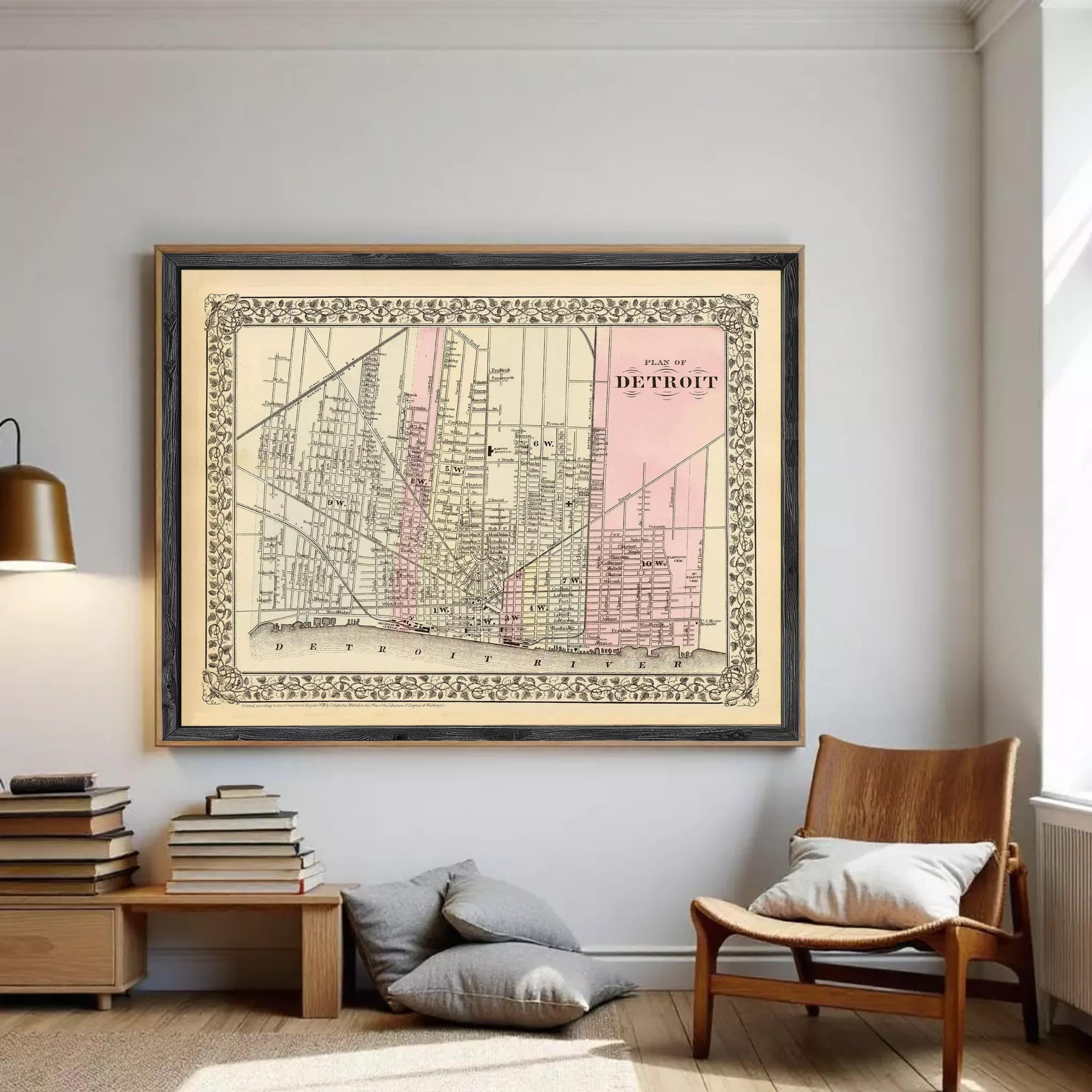 The image is a framed vintage map of Detroit, Michigan, depicting the city's streets and landmarks.