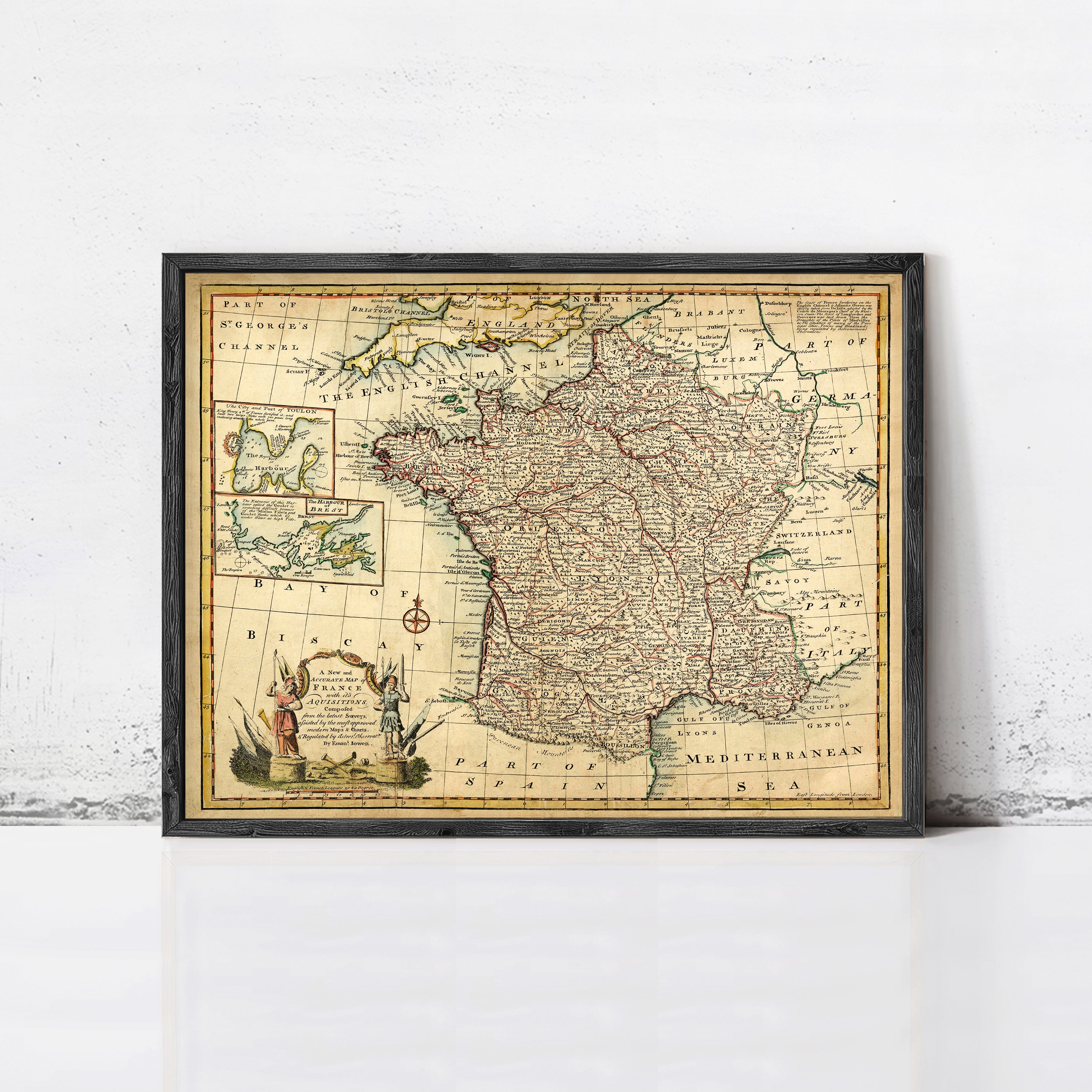The image is a framed vintage map of France, depicting the country's geographical layout and surrounding regions.