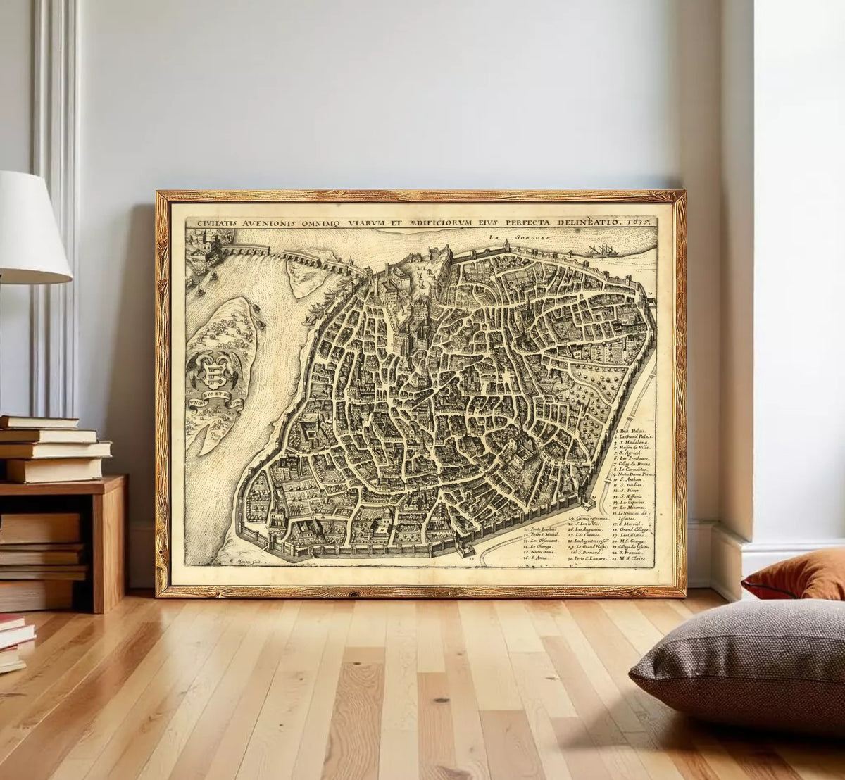 The image is a framed antique map of a city, likely from the 16th century, depicting a detailed layout of the city's streets and surrounding areas.