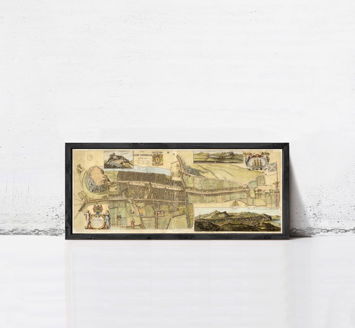 The image is a framed collage of various images, including a map, a landscape, and a historical scene, all set against a white wall.
