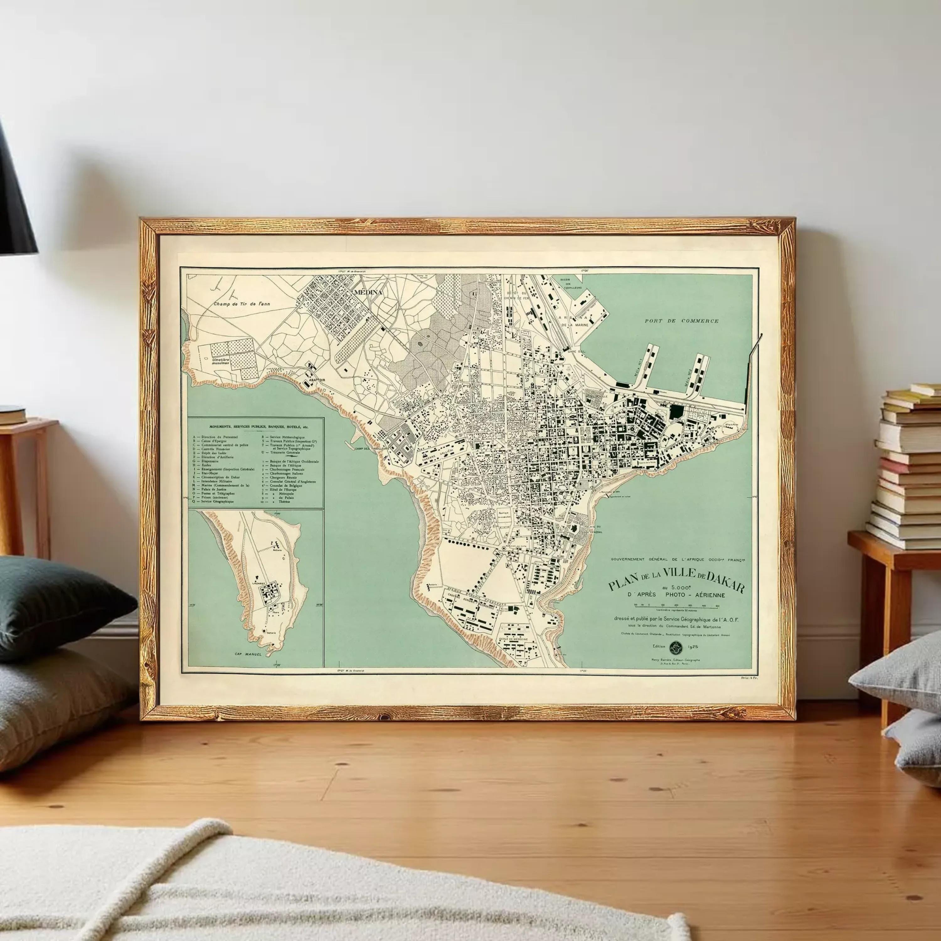 The image is a framed vintage map of a city, depicting a detailed layout of the streets, landmarks, and surrounding areas.