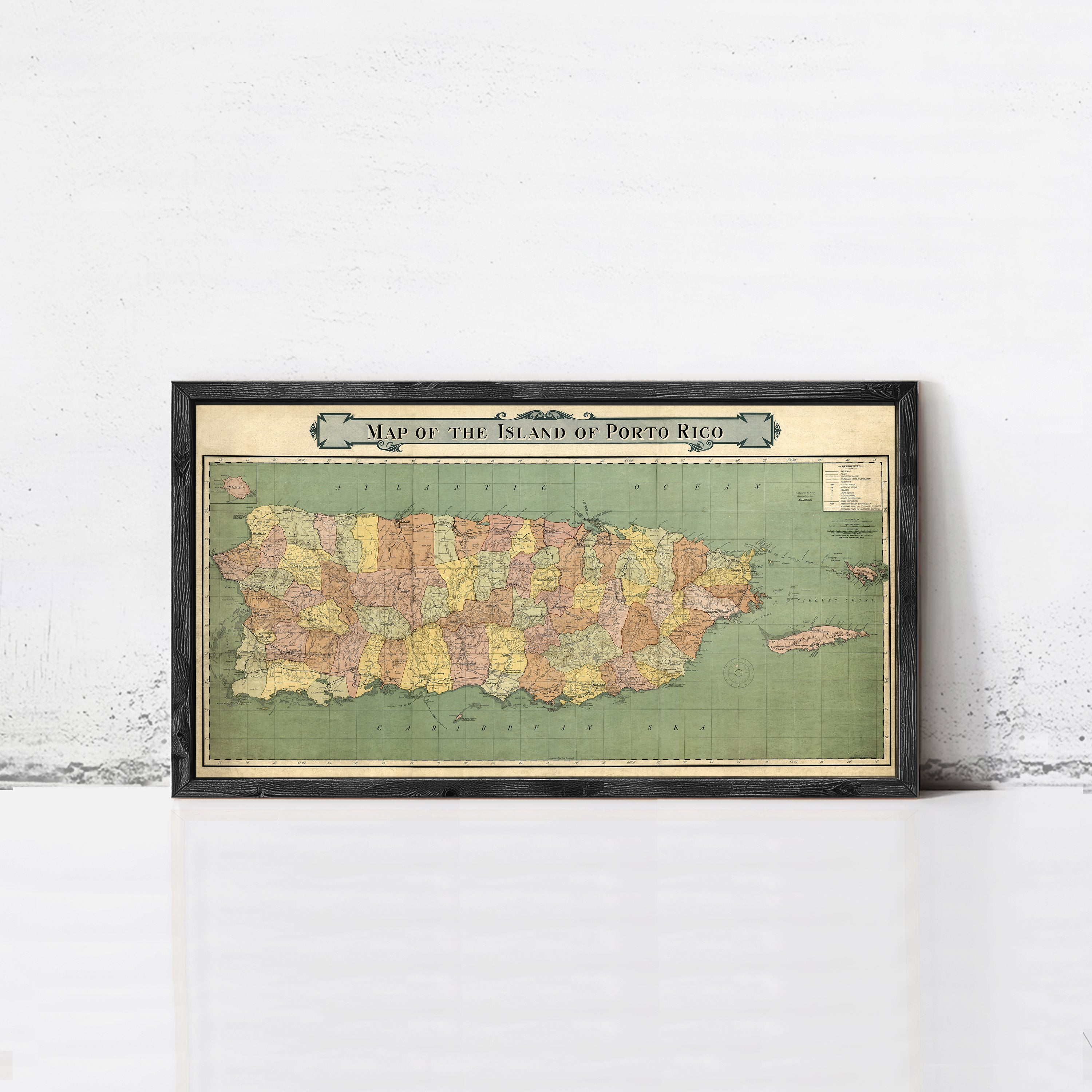 A framed vintage map of the island of Puerto Rico.