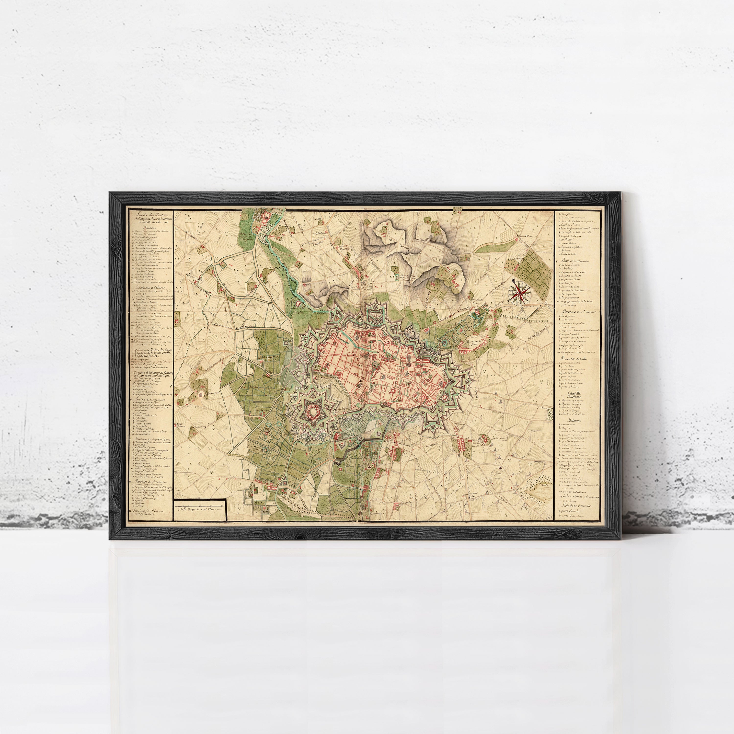 The image is a framed map of a city, likely Paris, with various landmarks and streets depicted.