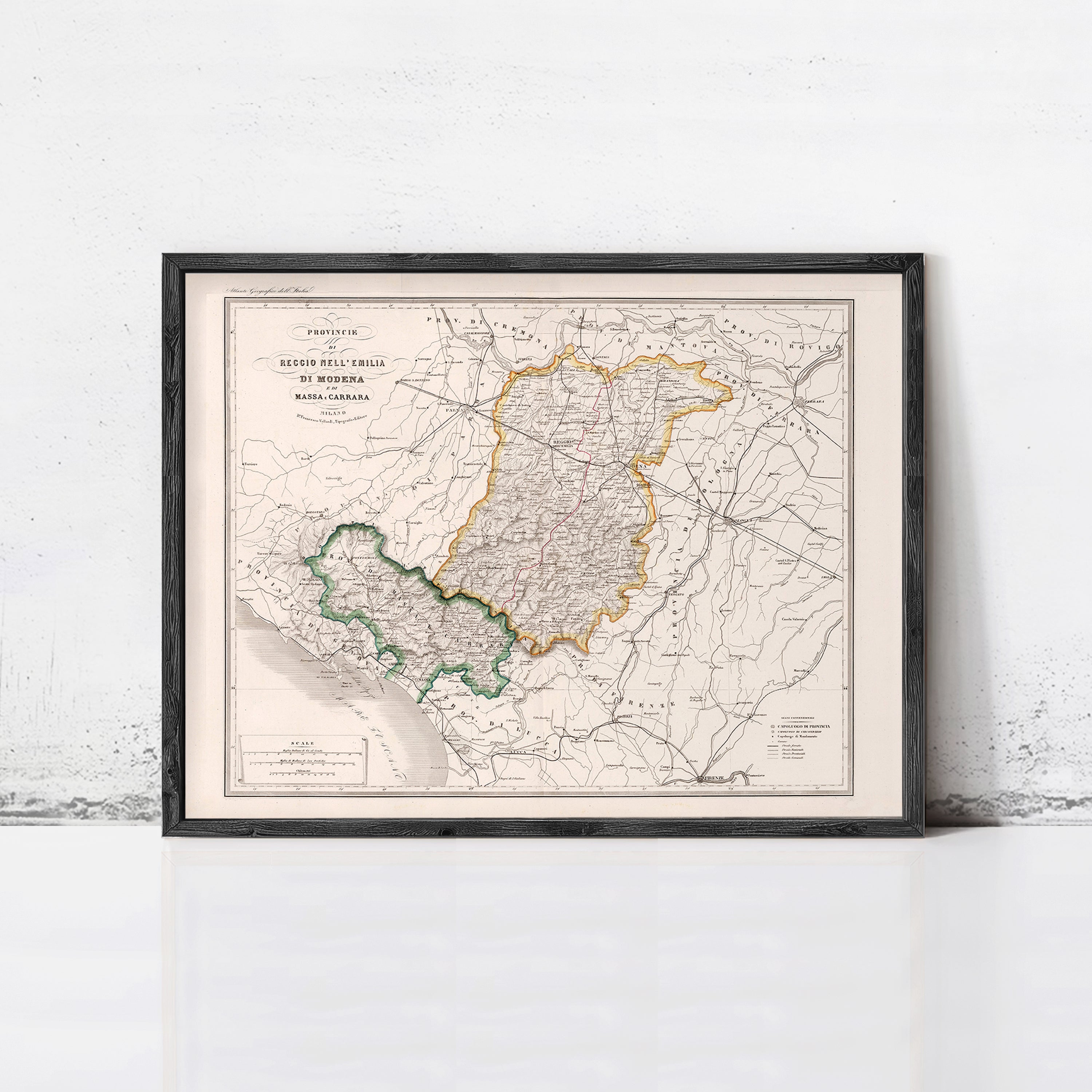 The image is a framed vintage map of a region, likely depicting a country or region, with various colored borders and detailed geographical information.