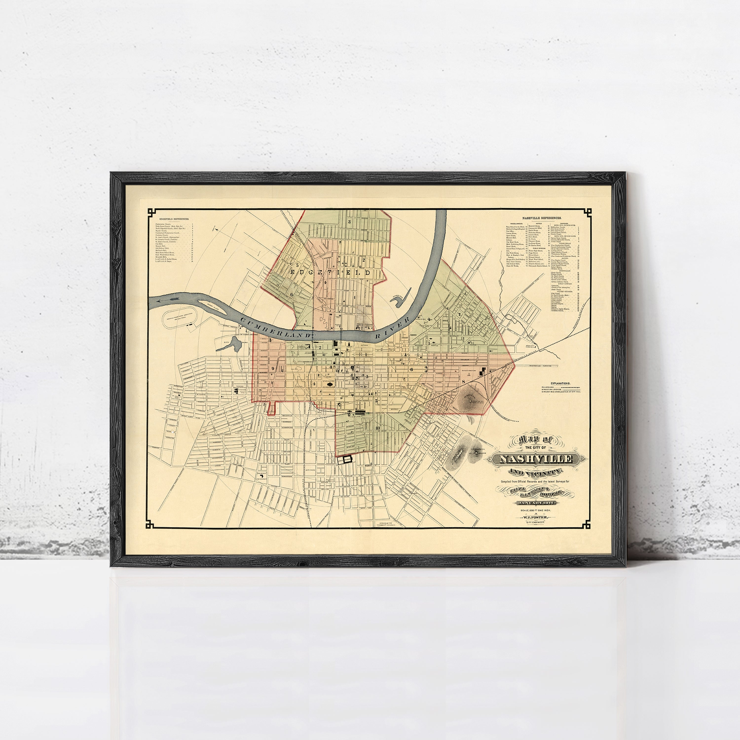 The image is a framed map of Nashville, Tennessee, depicting the city's streets and surrounding areas.