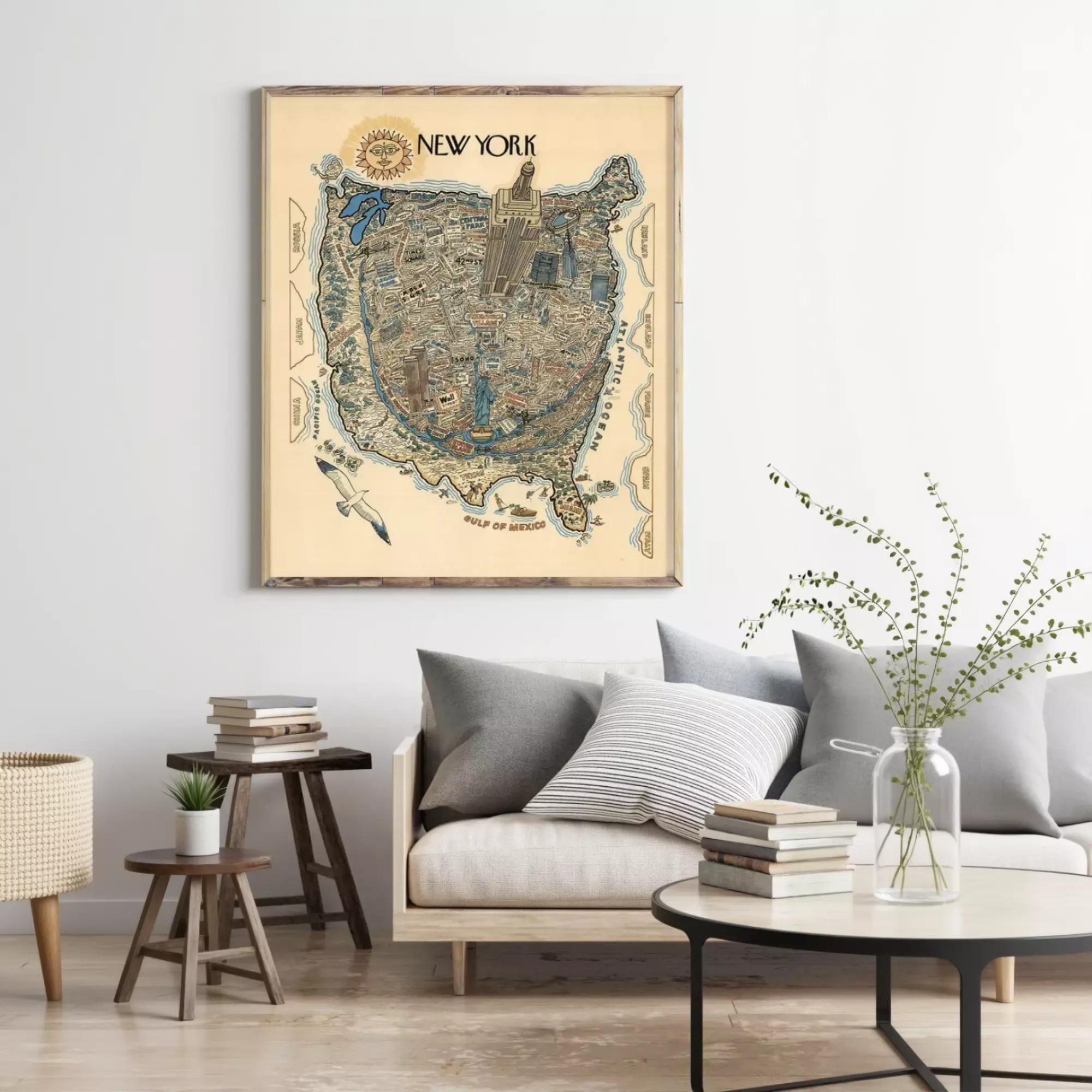 a large framed map of New York hanging on a wall in a living room setting.