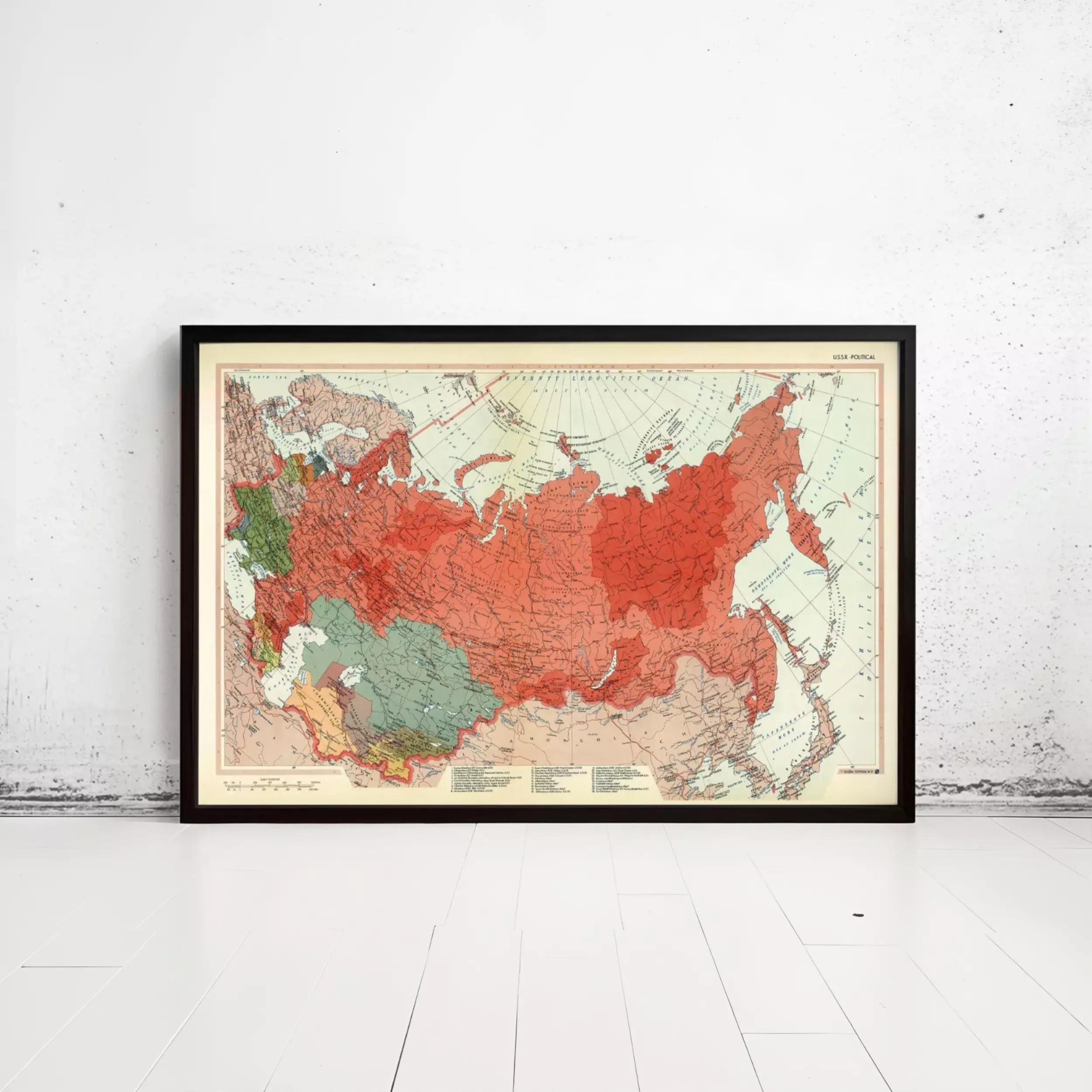 The image is a framed map of the world, depicting the continents and major landmasses in a stylized manner.