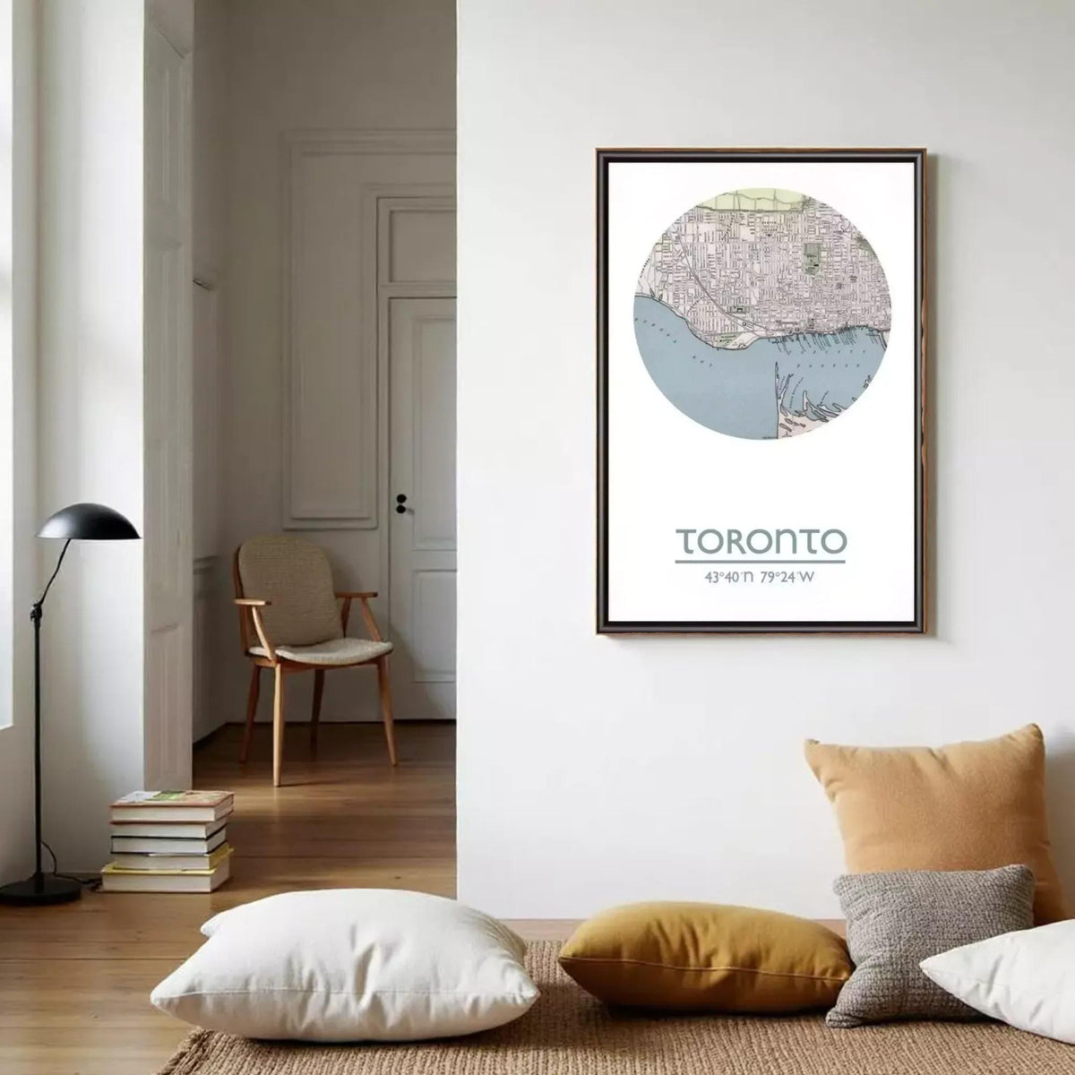 a framed map of Toronto, Canada, hanging on a wall in a living room setting.