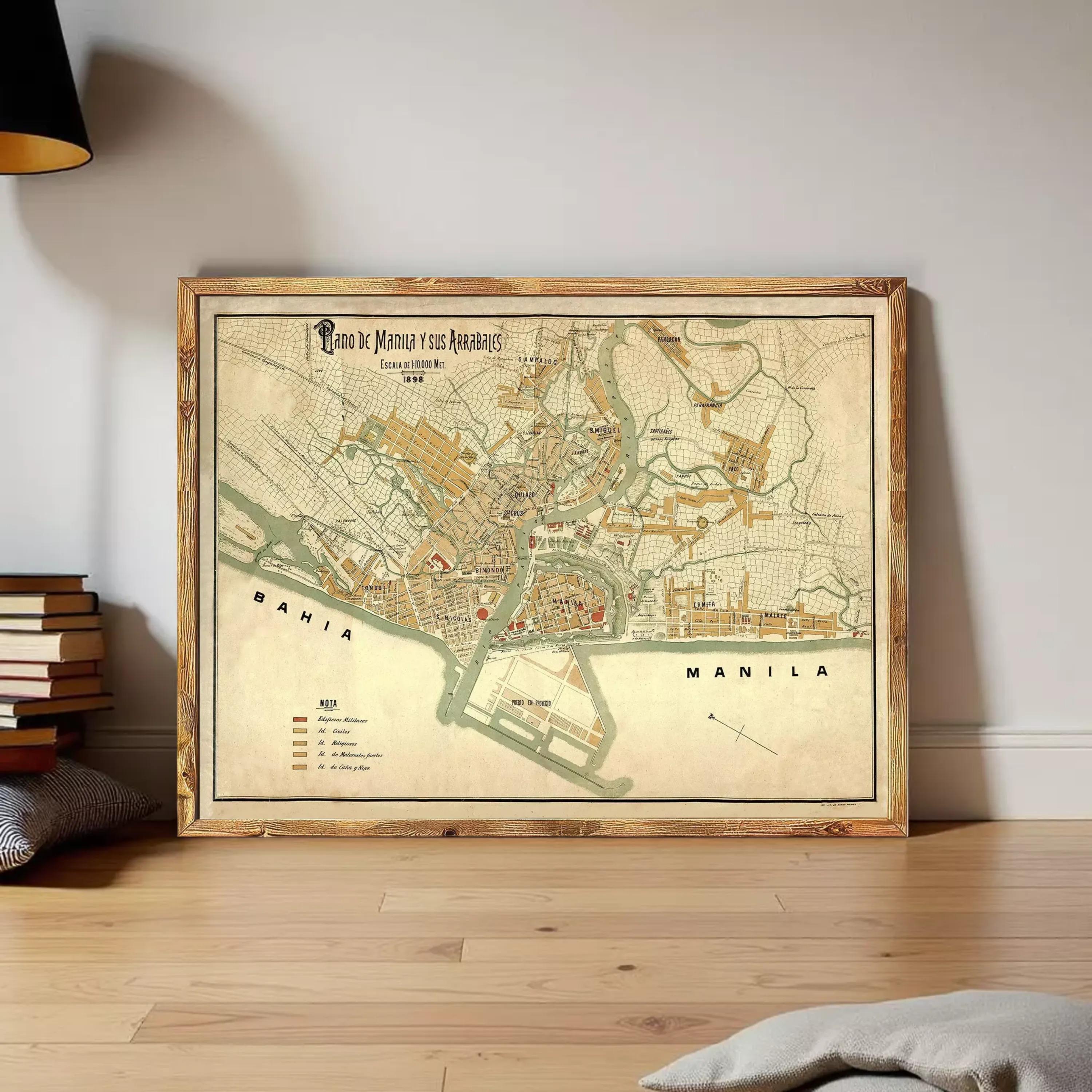 A framed map of Manila, Philippines, displayed on a wall.