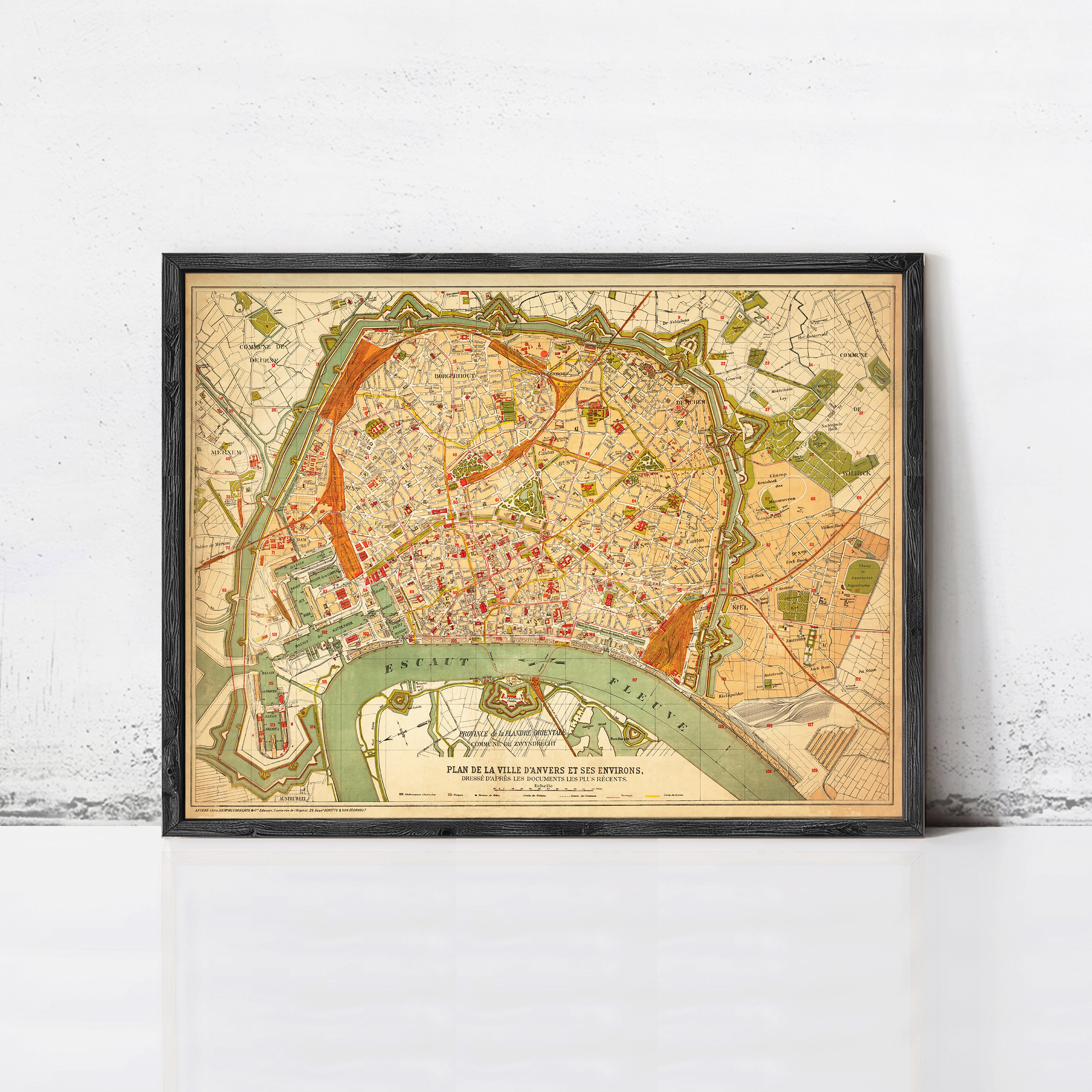 The image is a framed vintage map of Paris, France, depicting the city's layout and surrounding areas.