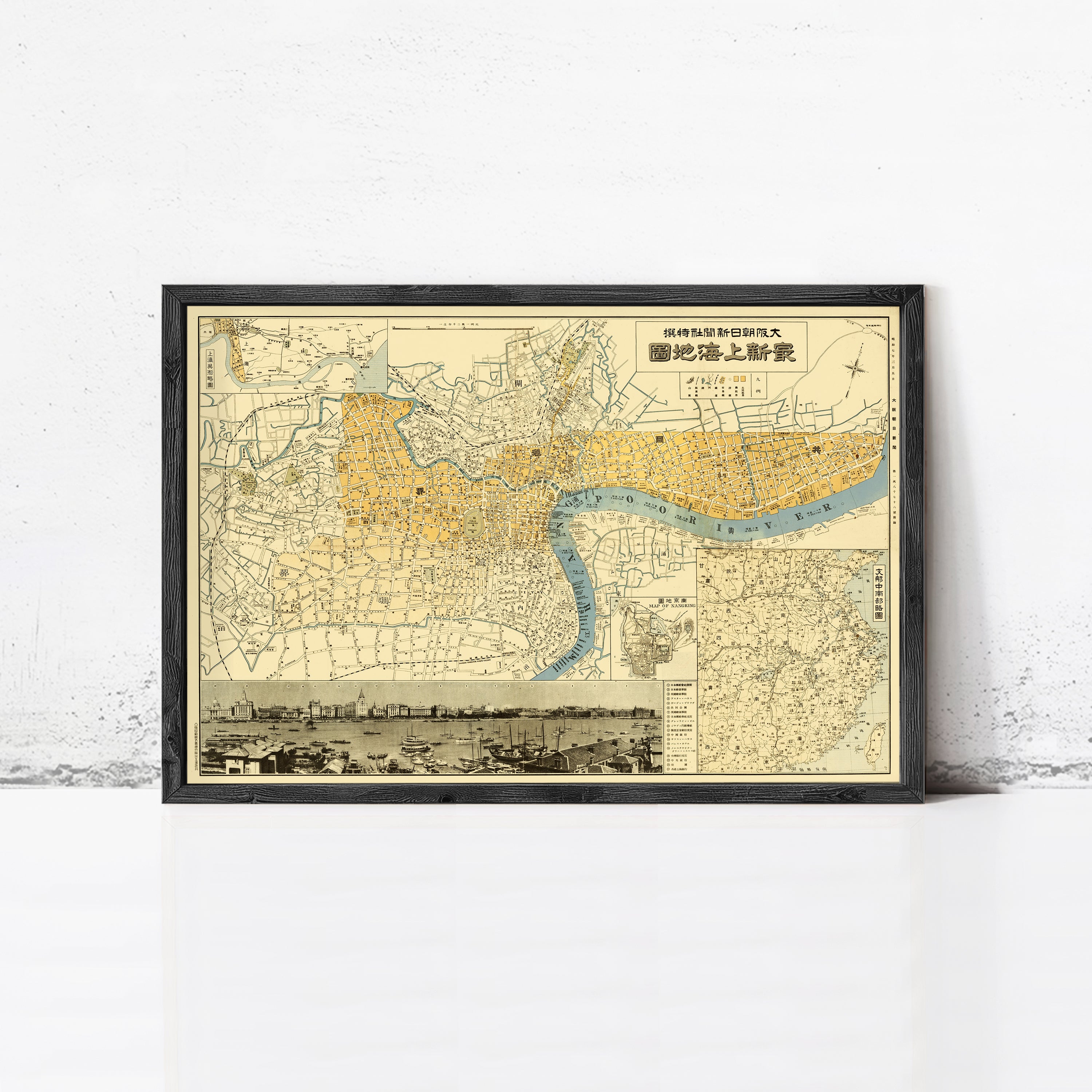 The image is a framed vintage map of London, England, with a black border and yellow and blue color scheme.