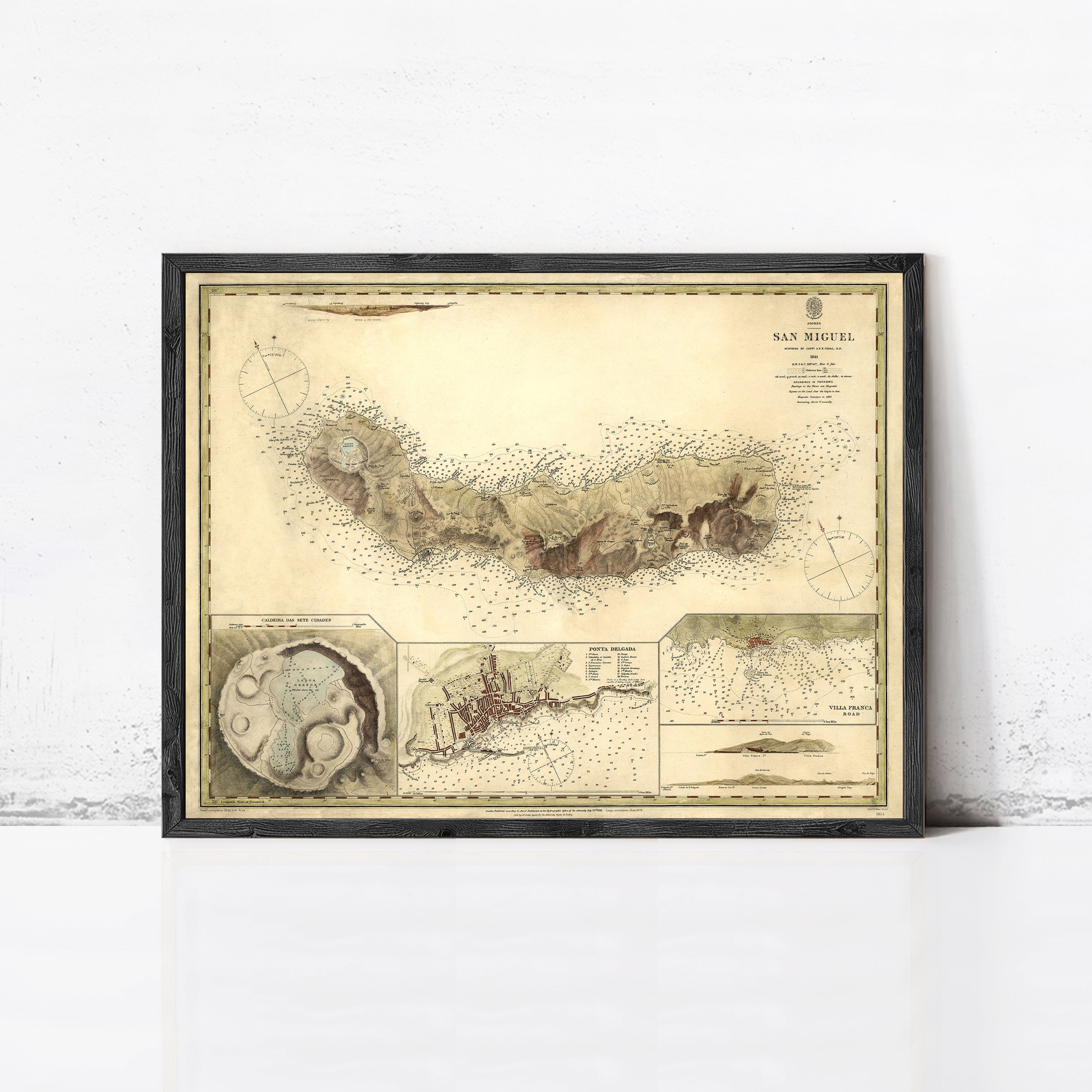The image is a framed vintage map of San Miguel, showing a detailed illustration of the island's landscape and surrounding areas.