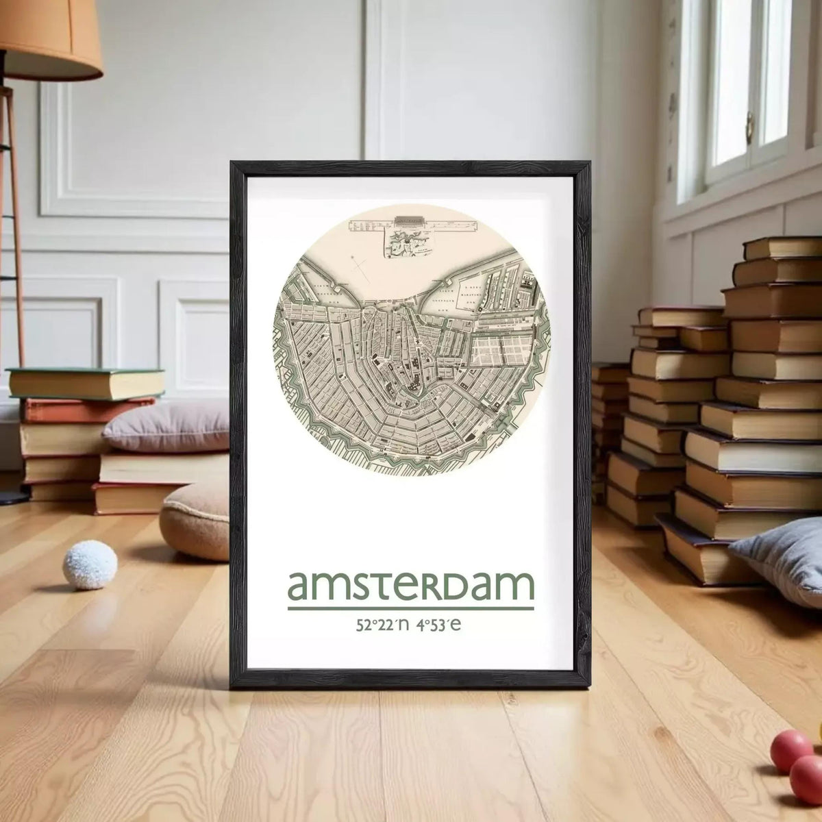 The image is a framed print of a map of Amsterdam, with the city's name and location printed below the map.