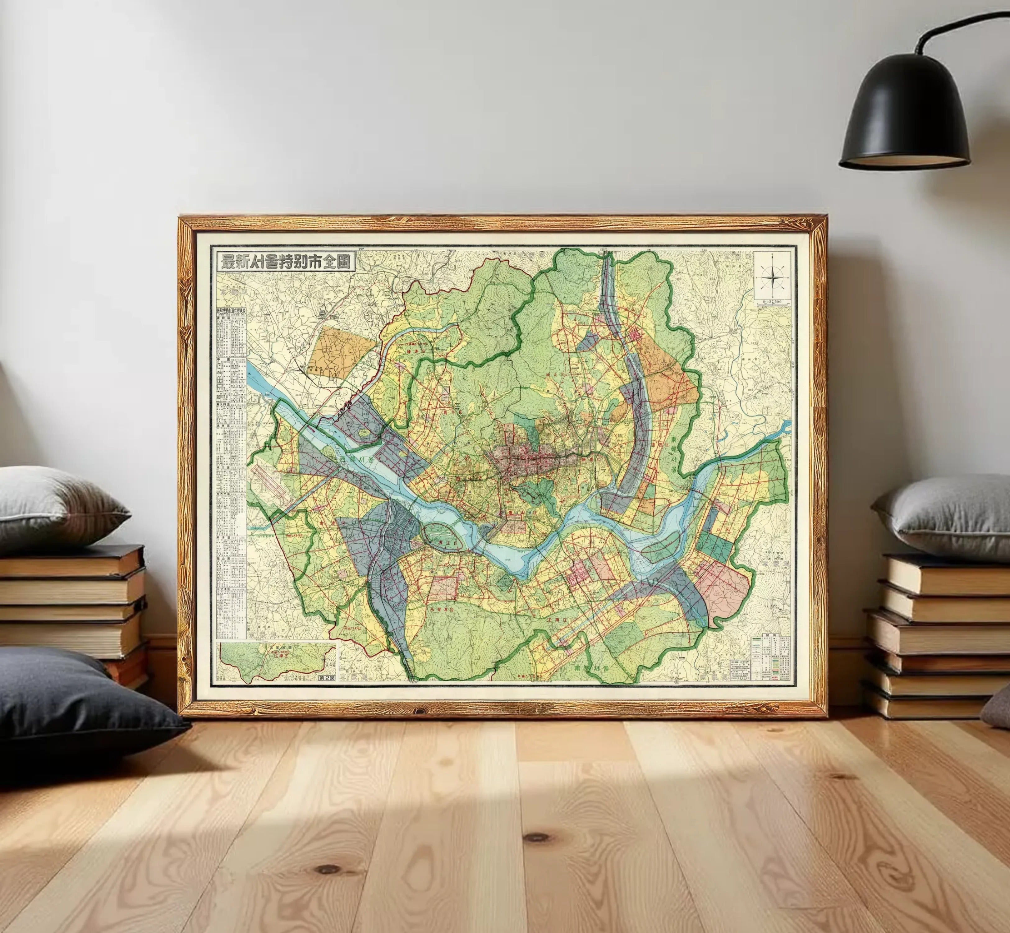 The image is a framed vintage map of a city, depicting various streets, landmarks, and geographical features.