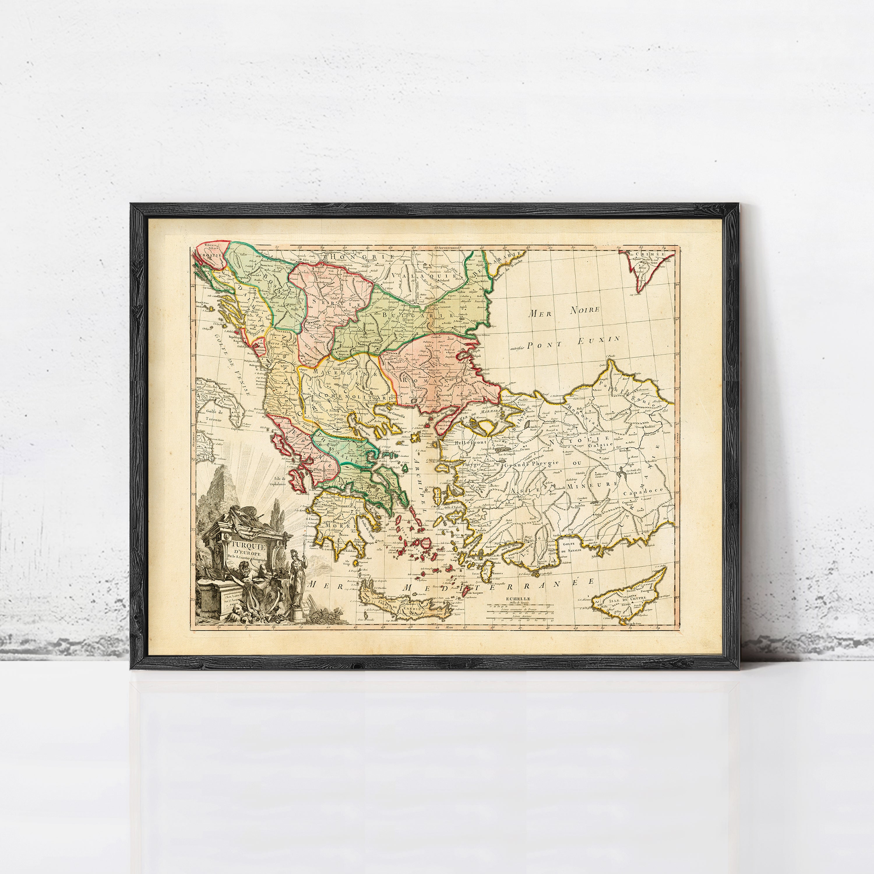 The image is a framed antique map of Europe, depicting the countries and regions of the continent in a vintage style.
