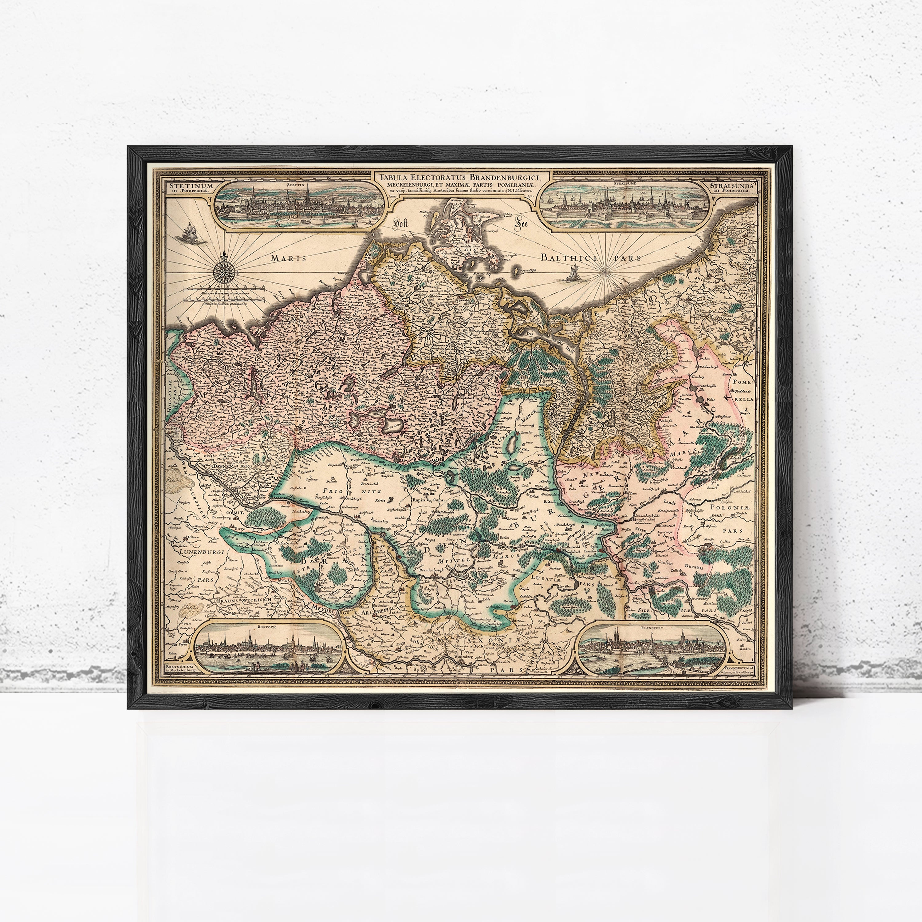 The image is a framed vintage map of Europe, depicting various countries and regions with intricate details and labels.