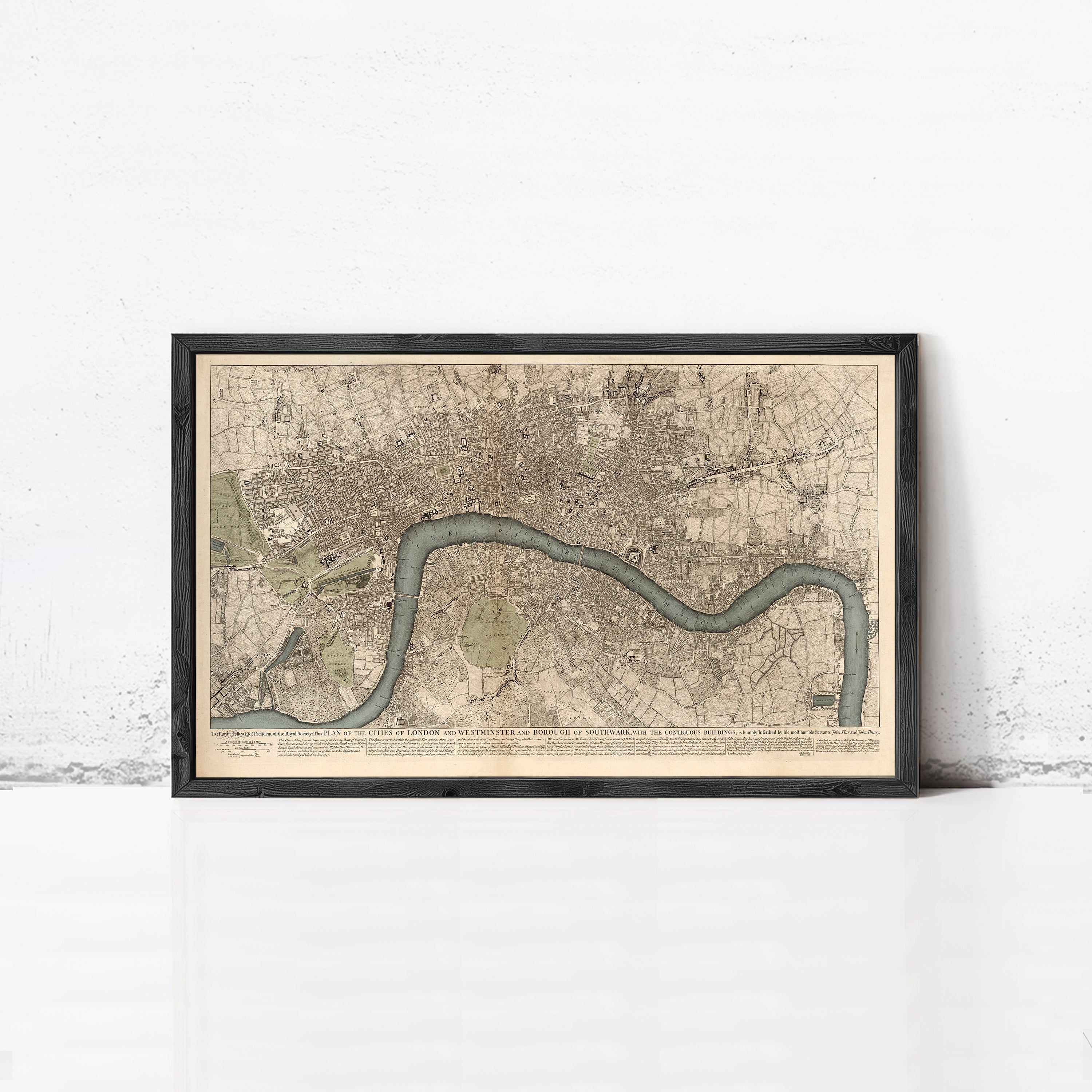 The image is a framed map of London, England, depicting the city's layout and surrounding areas.