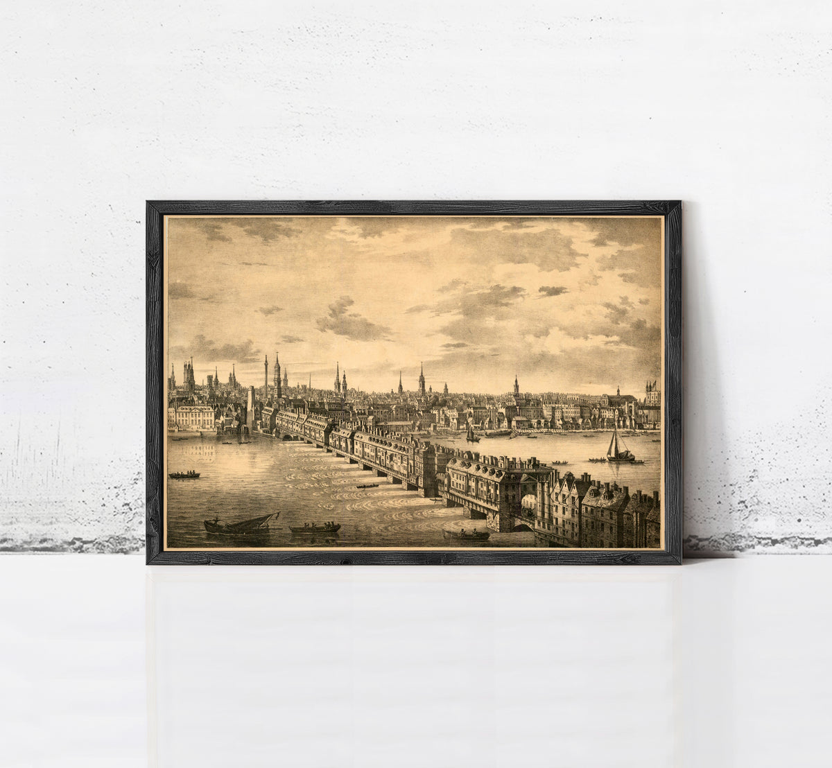 The image is a framed print depicting a cityscape with a river and boats, possibly from the 19th century.
