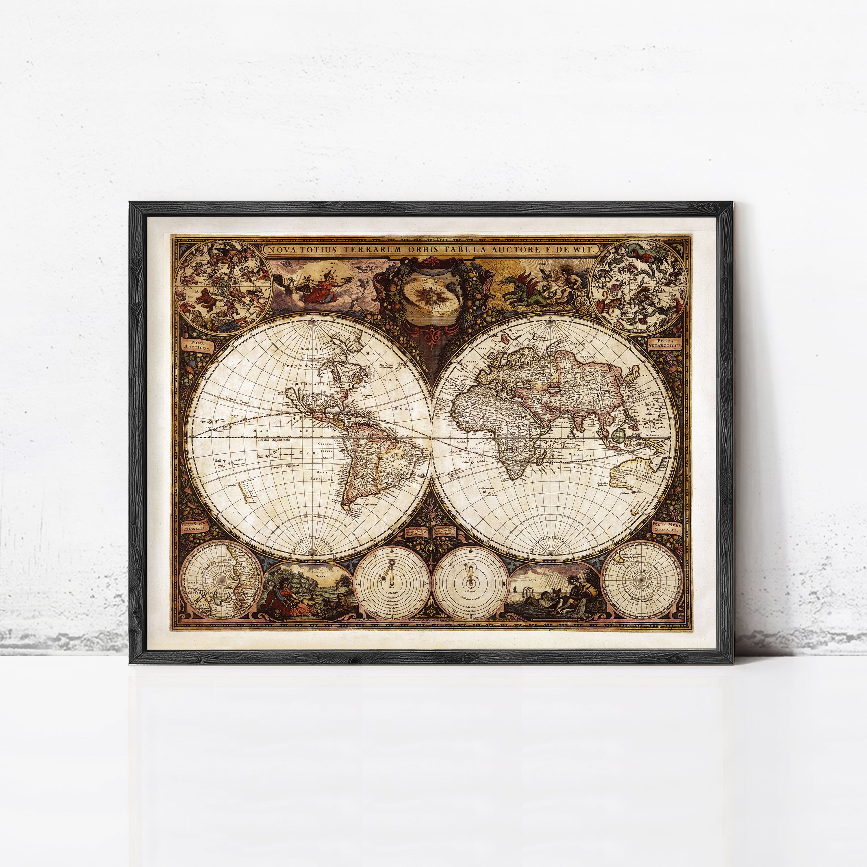 The image is a framed antique map of the world, featuring intricate details and decorative elements.