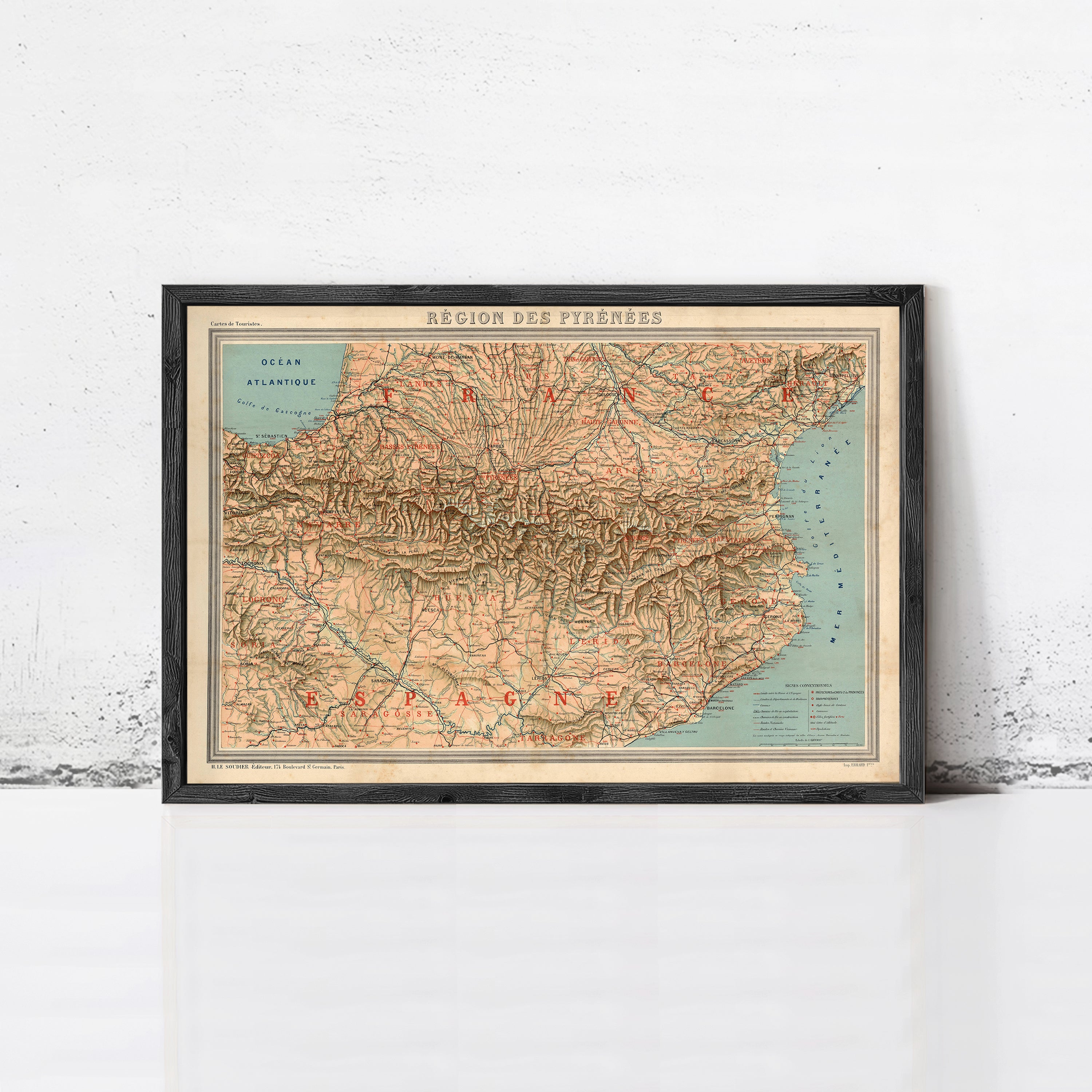 The image is a framed vintage map of the region of the Pyrenees, depicting the mountainous terrain and surrounding areas.