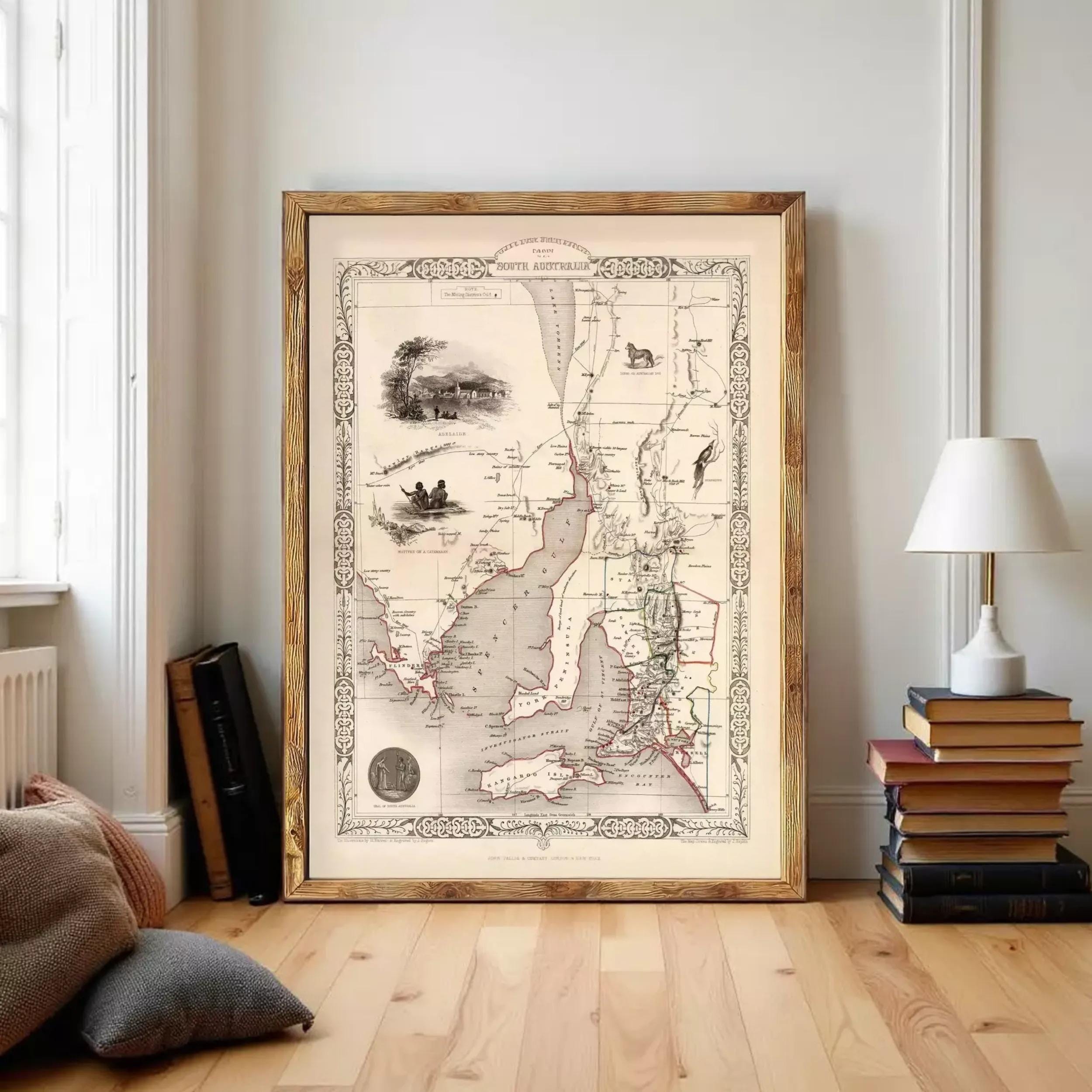 The image is a framed antique map of the South Australian region, featuring detailed illustrations and geographical information.